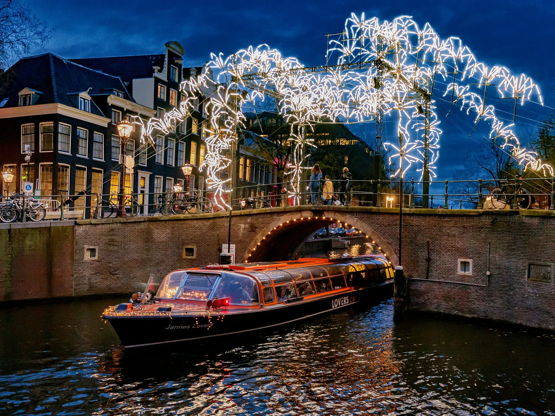 Canal cruise passing under bridge