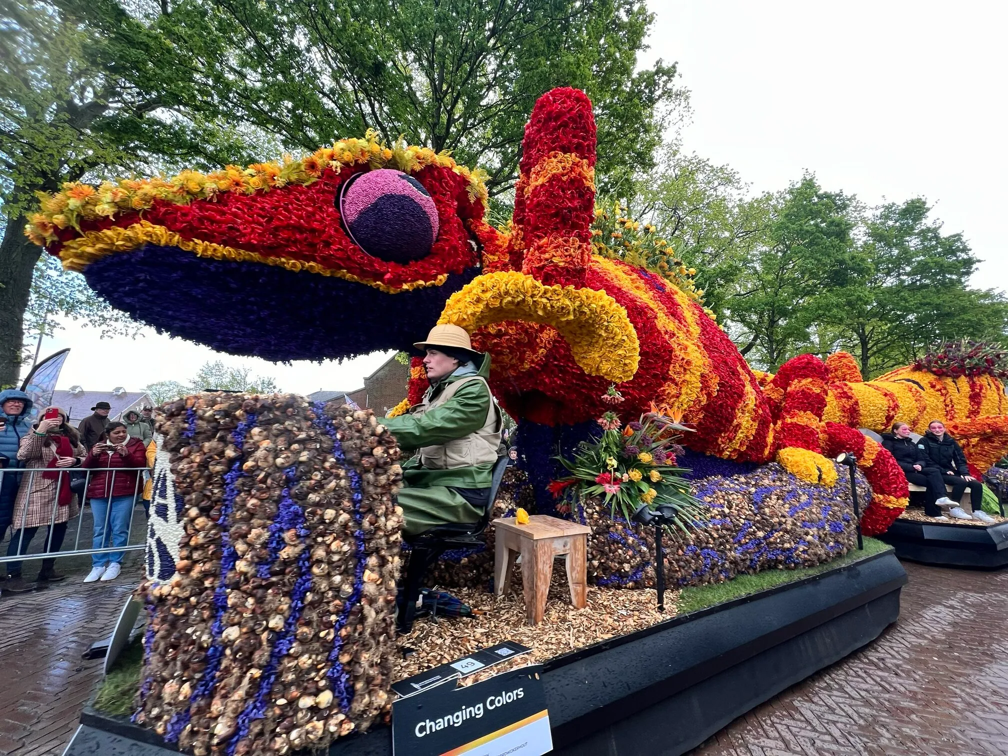 Flower parade floats and spring crowds