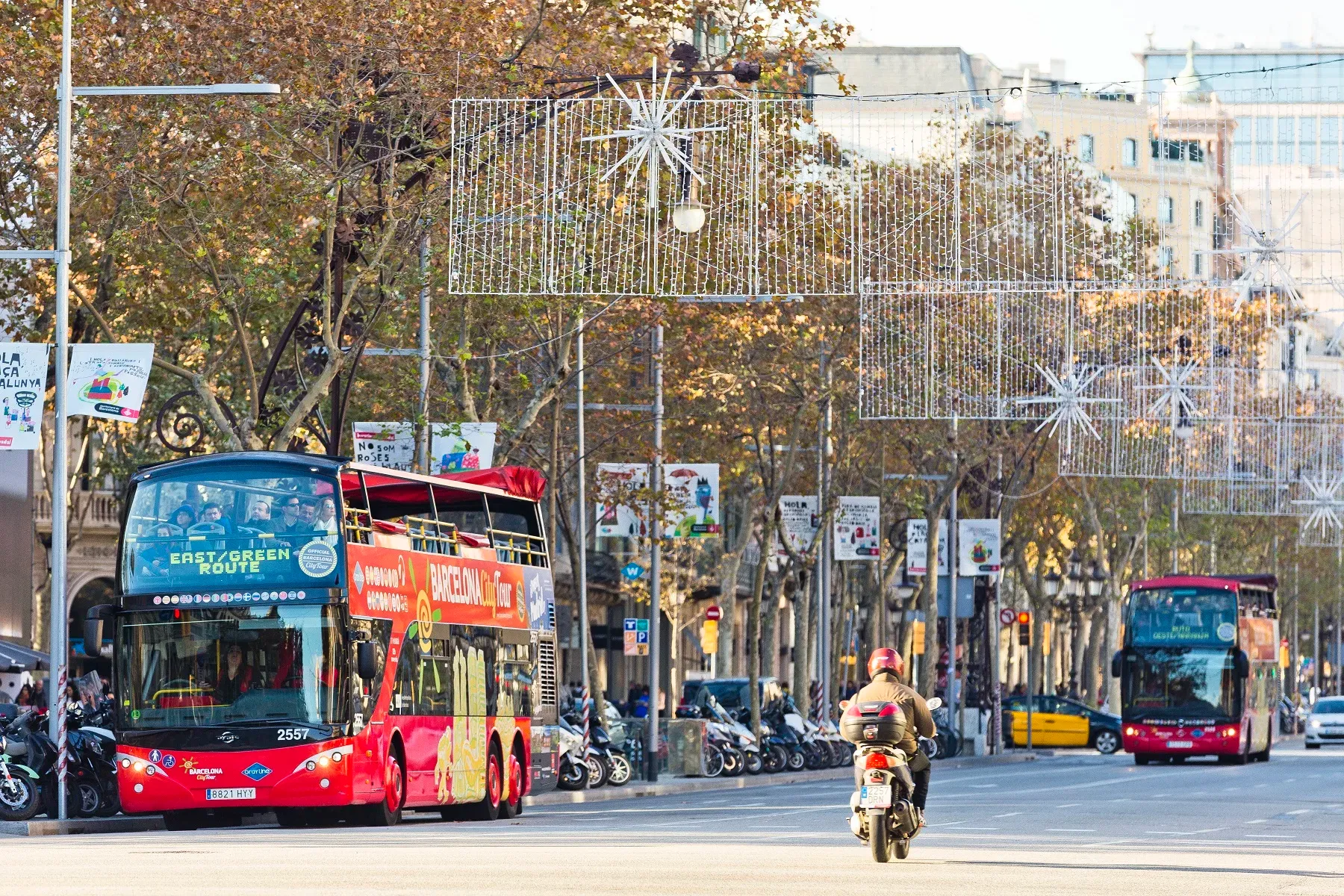 City tour bus on main road in Barcelona