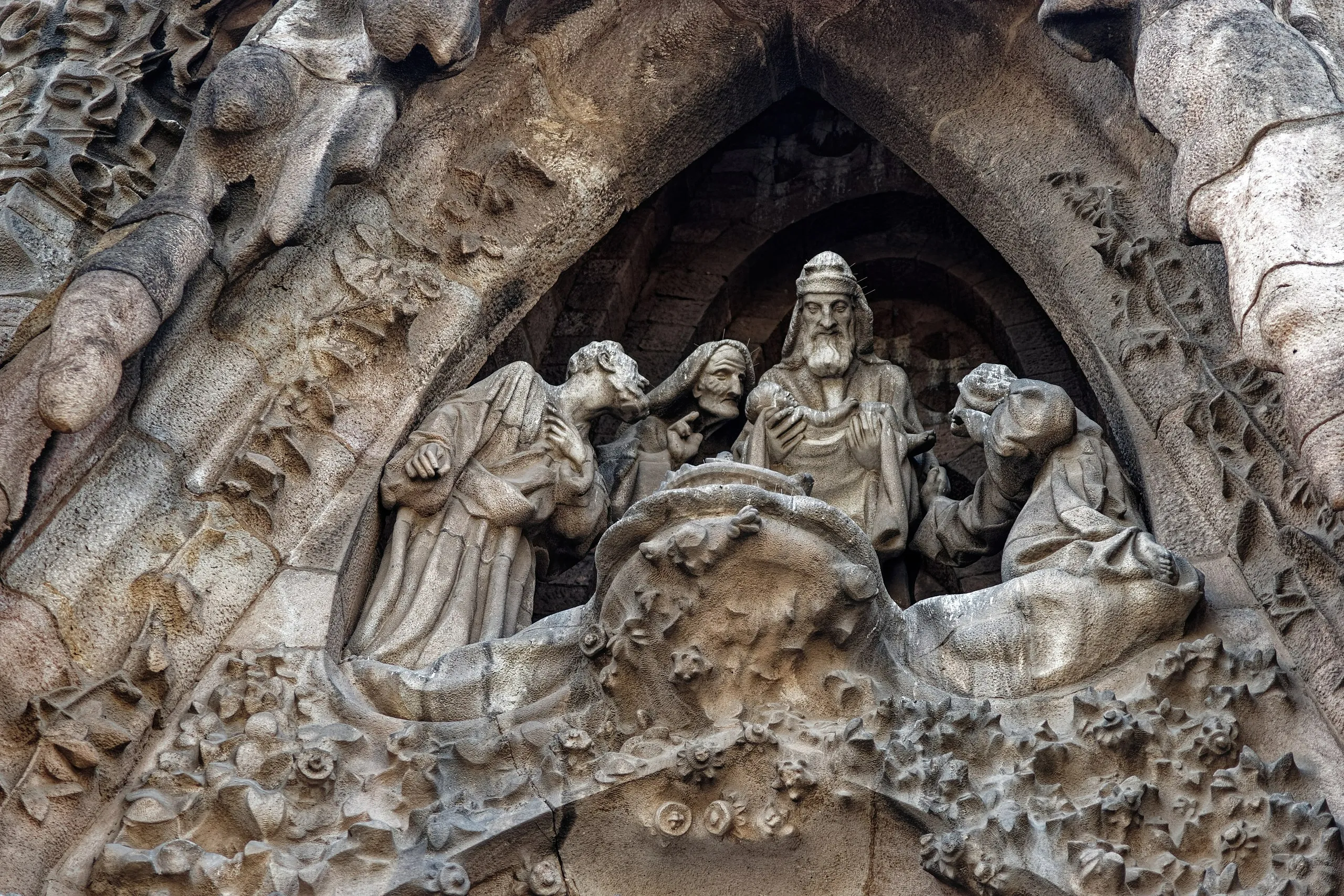 Richly sculpted stone of the Sagrada Família Nativity Façade with flora and figures