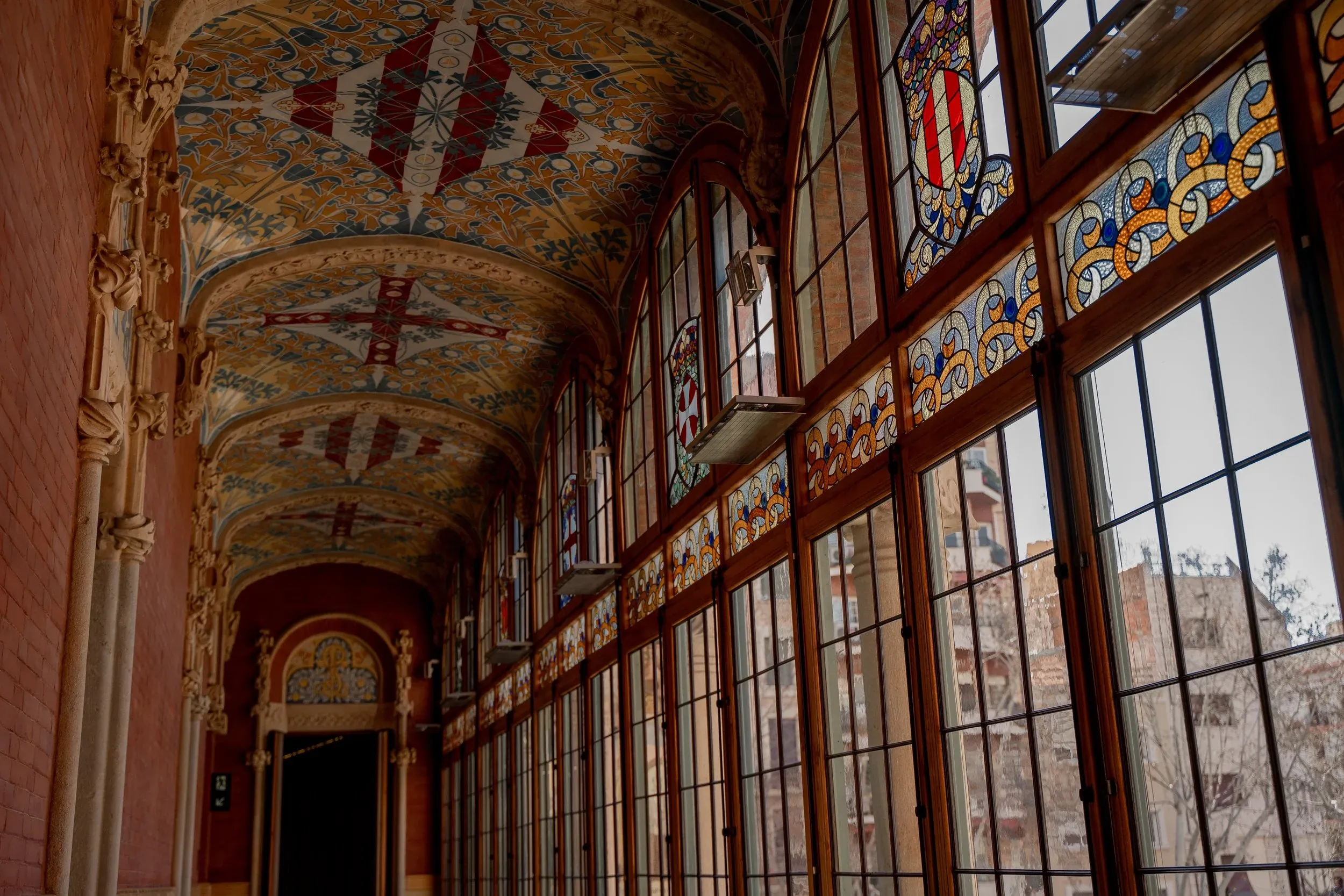 Historic hospital corridor with large windows