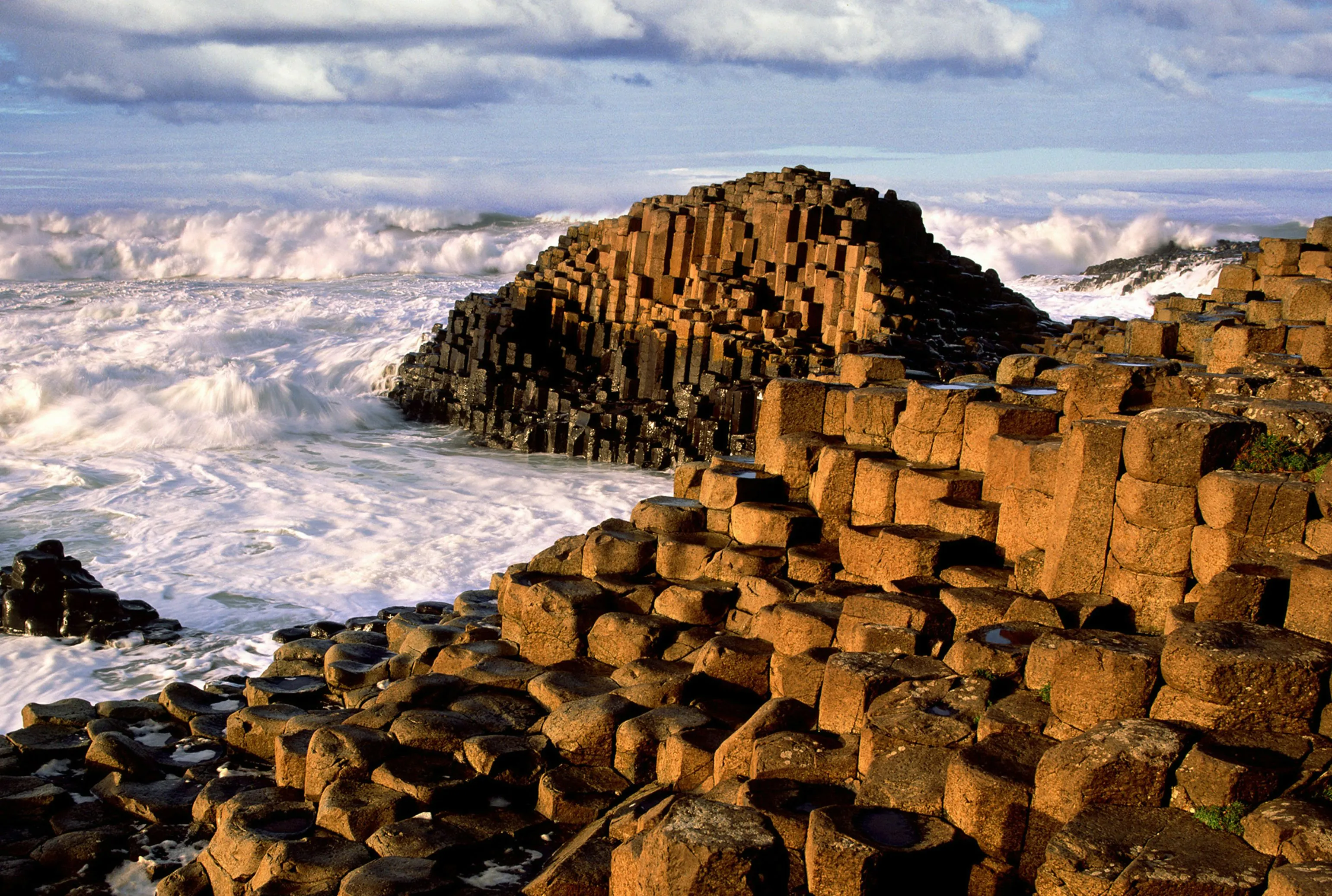 Storm foam crashing against the Causeway stones