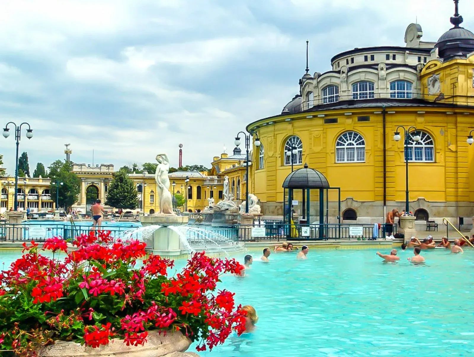 Flower-lined poolside at Széchenyi Baths in spring