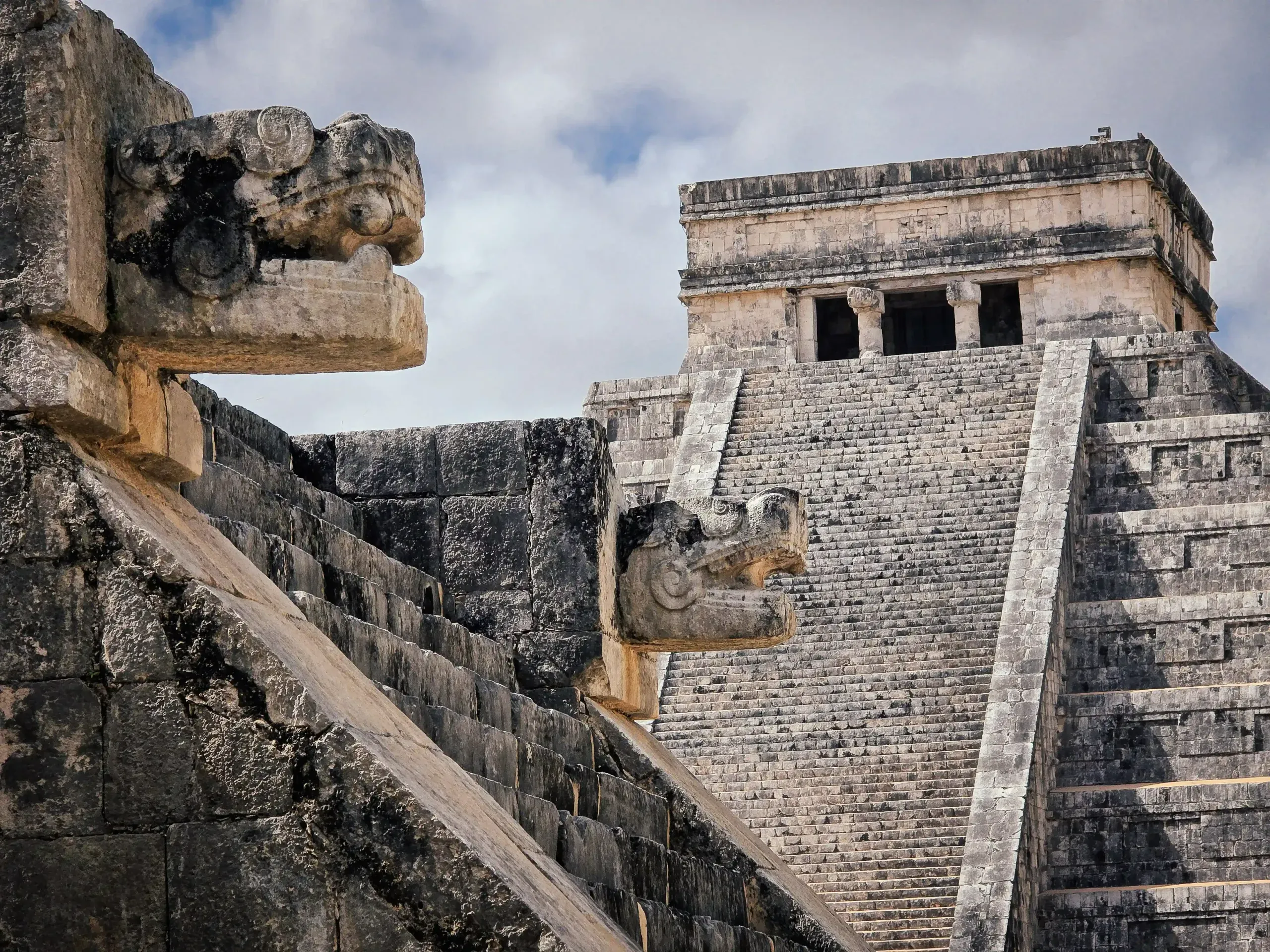 Serpent head stone detail on Chichen Itza staircase