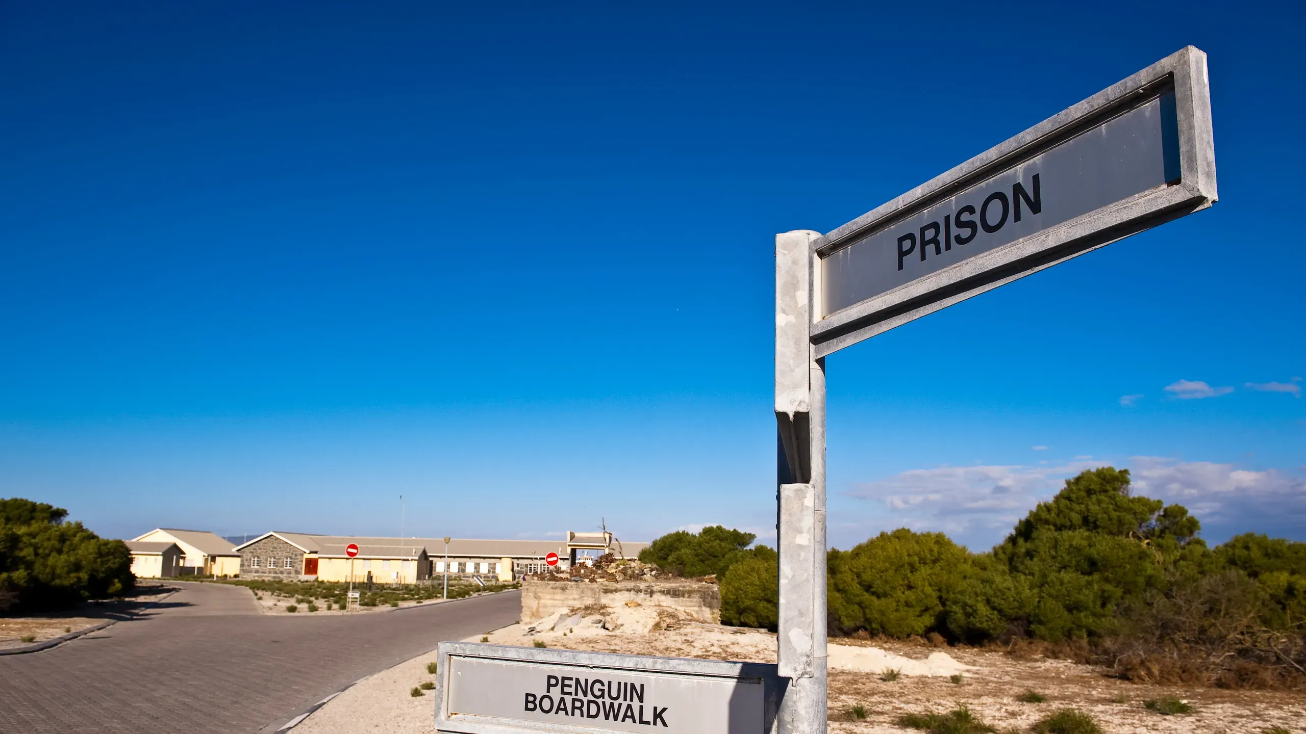 Historic remains and coastal terrain on Robben Island under bright Cape light