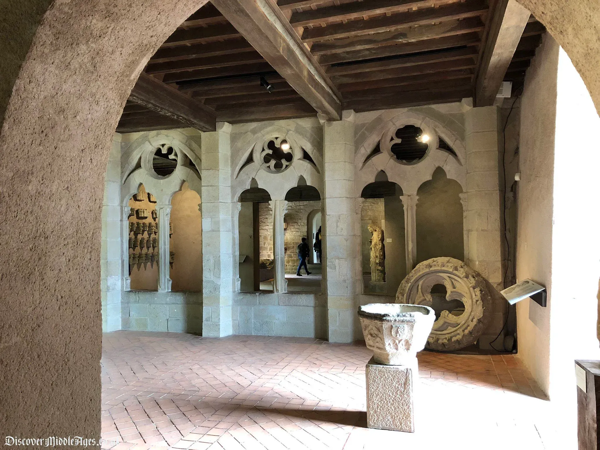 Stone interior room and wooden ceiling inside the Château Comtal