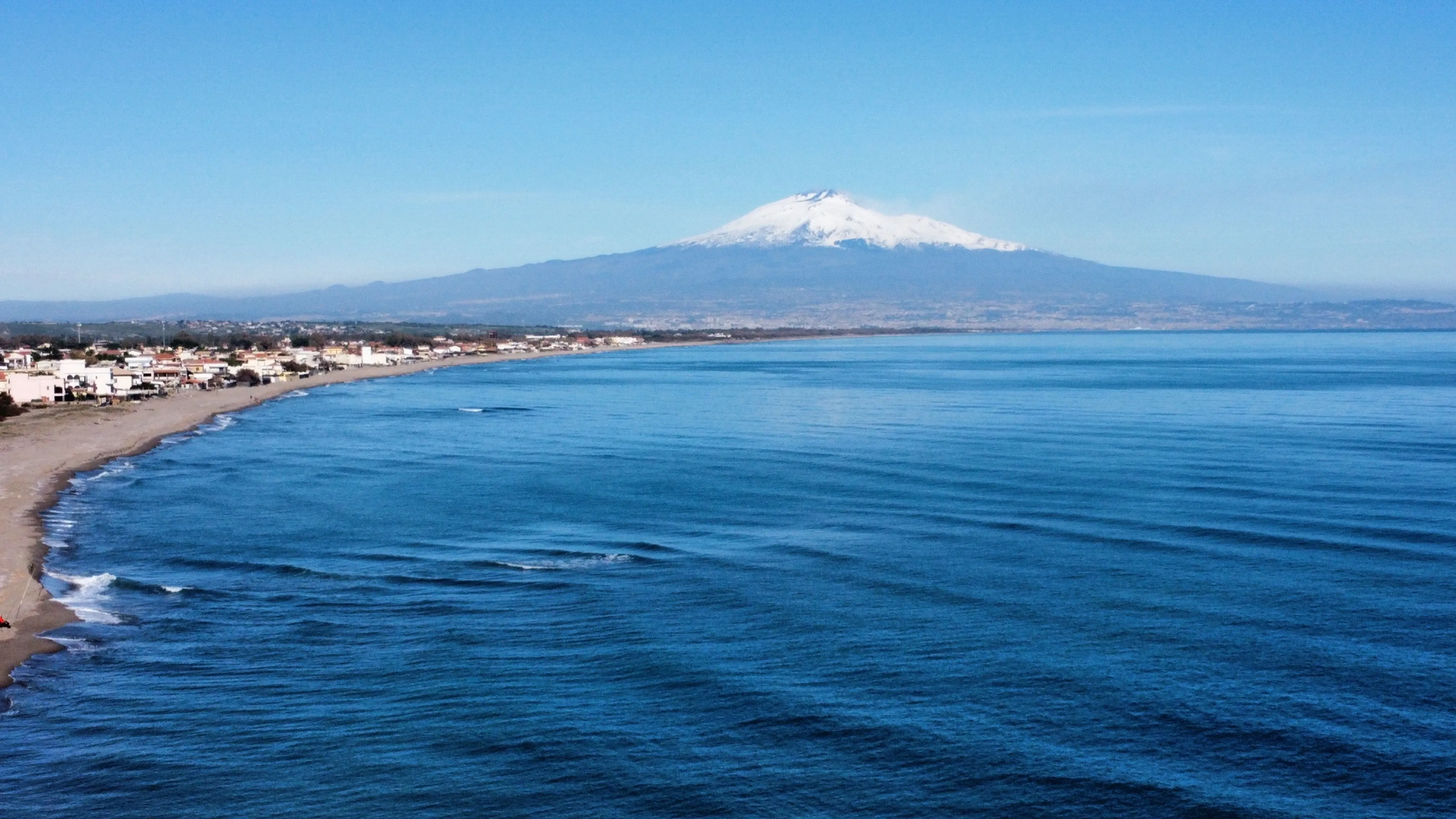 Wide Mount Etna slope descending toward the Sicilian sea