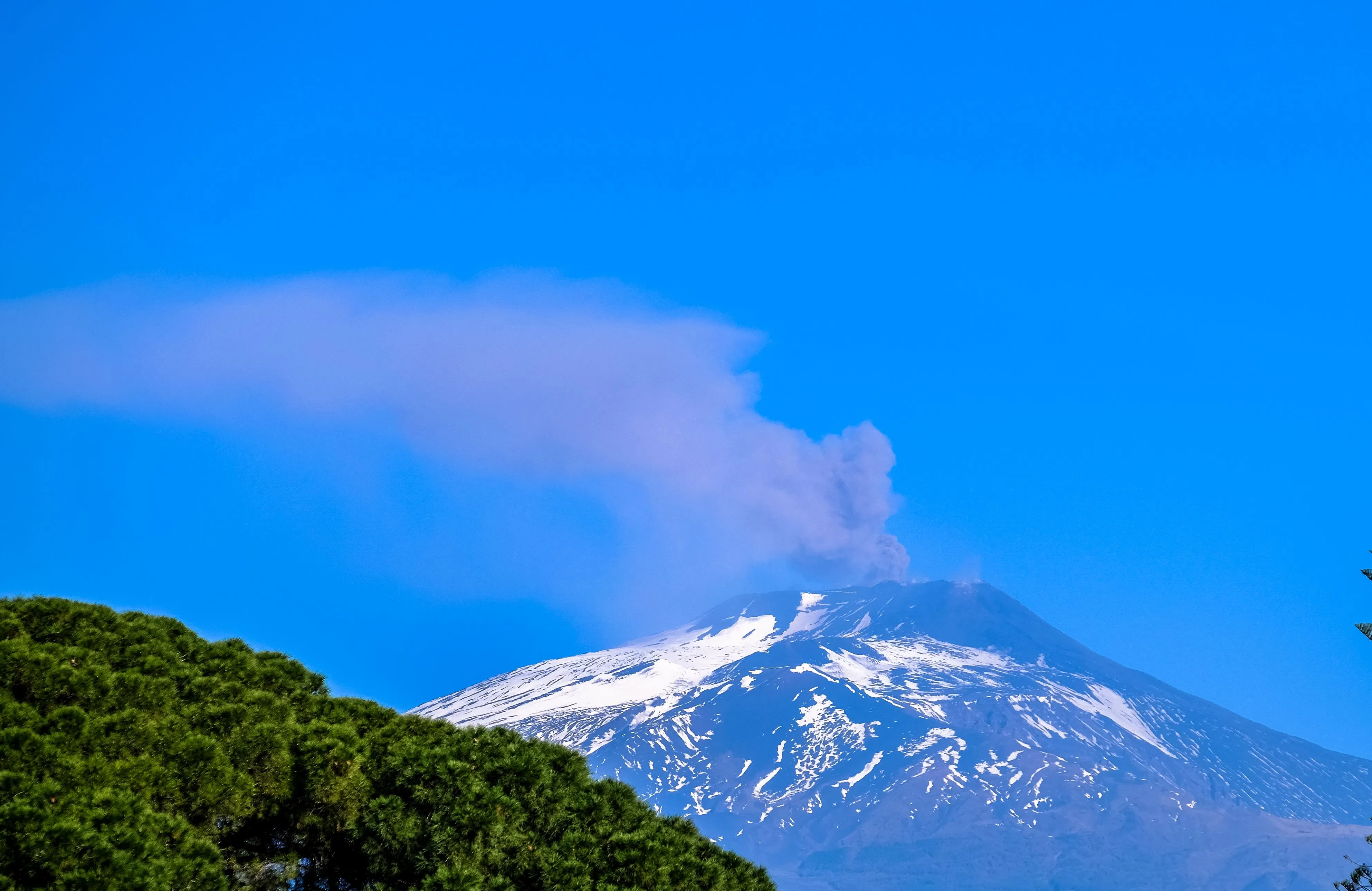 Mount Etna plume visible from a distant viewpoint