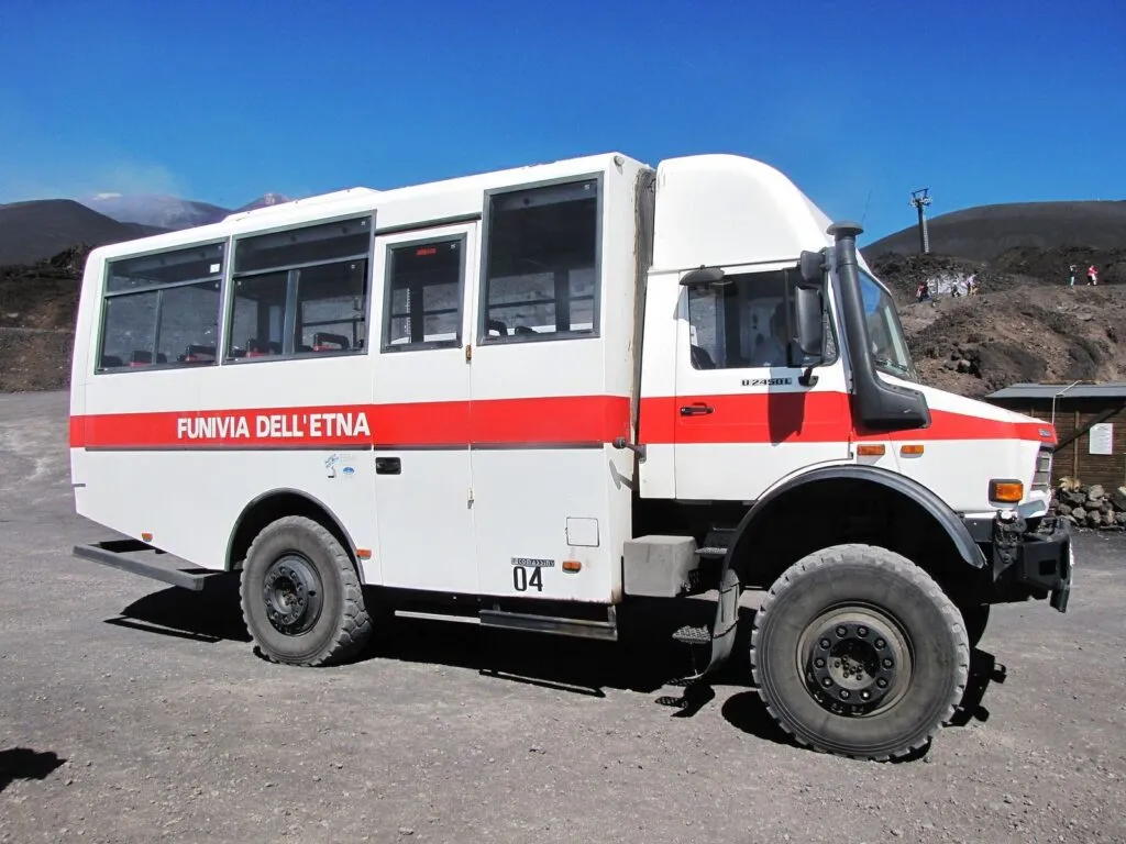 Off-road minibus transfer on volcanic terrain on Mount Etna
