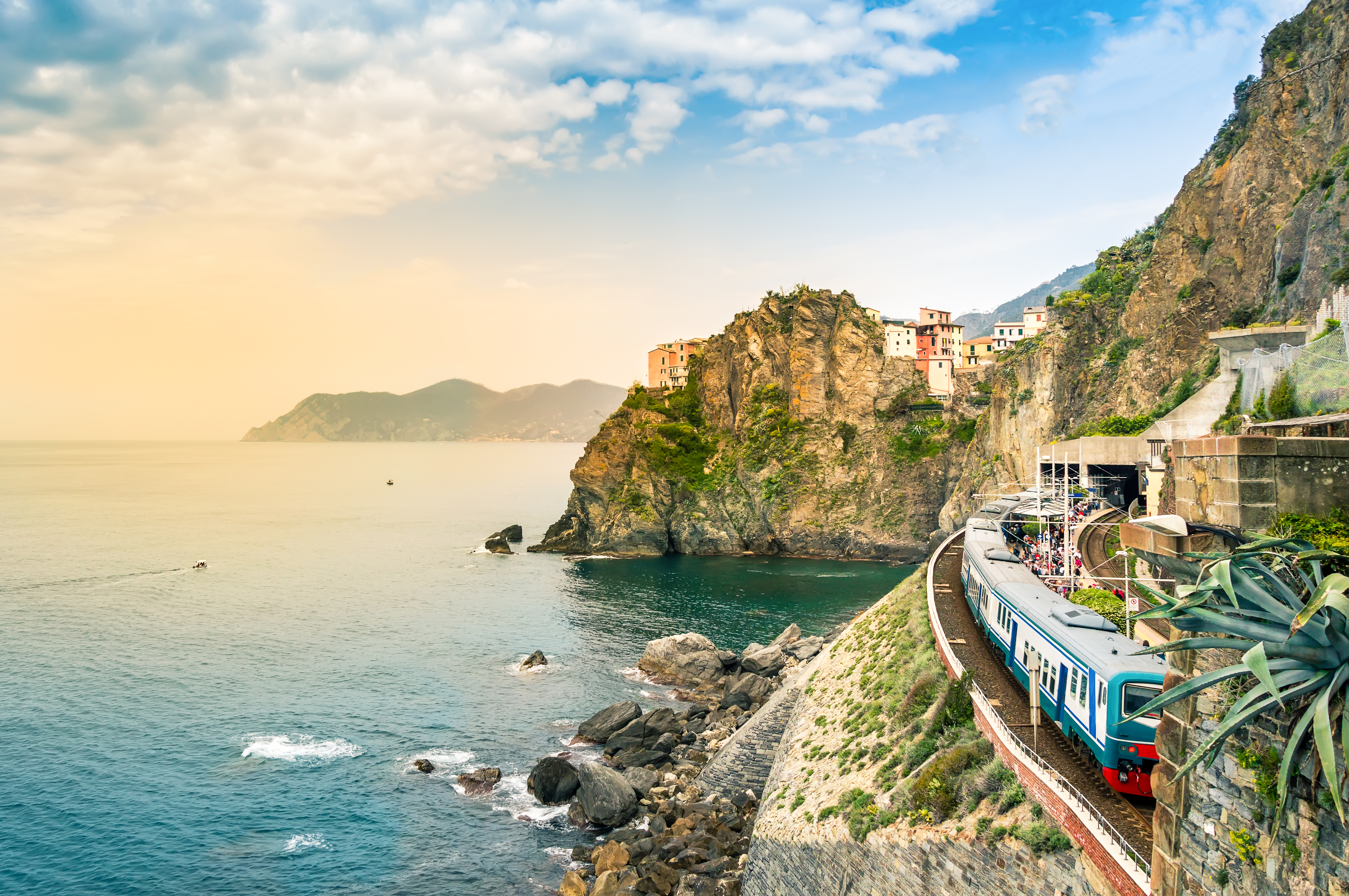 Passengers waiting at Manarola train station near the cliffs