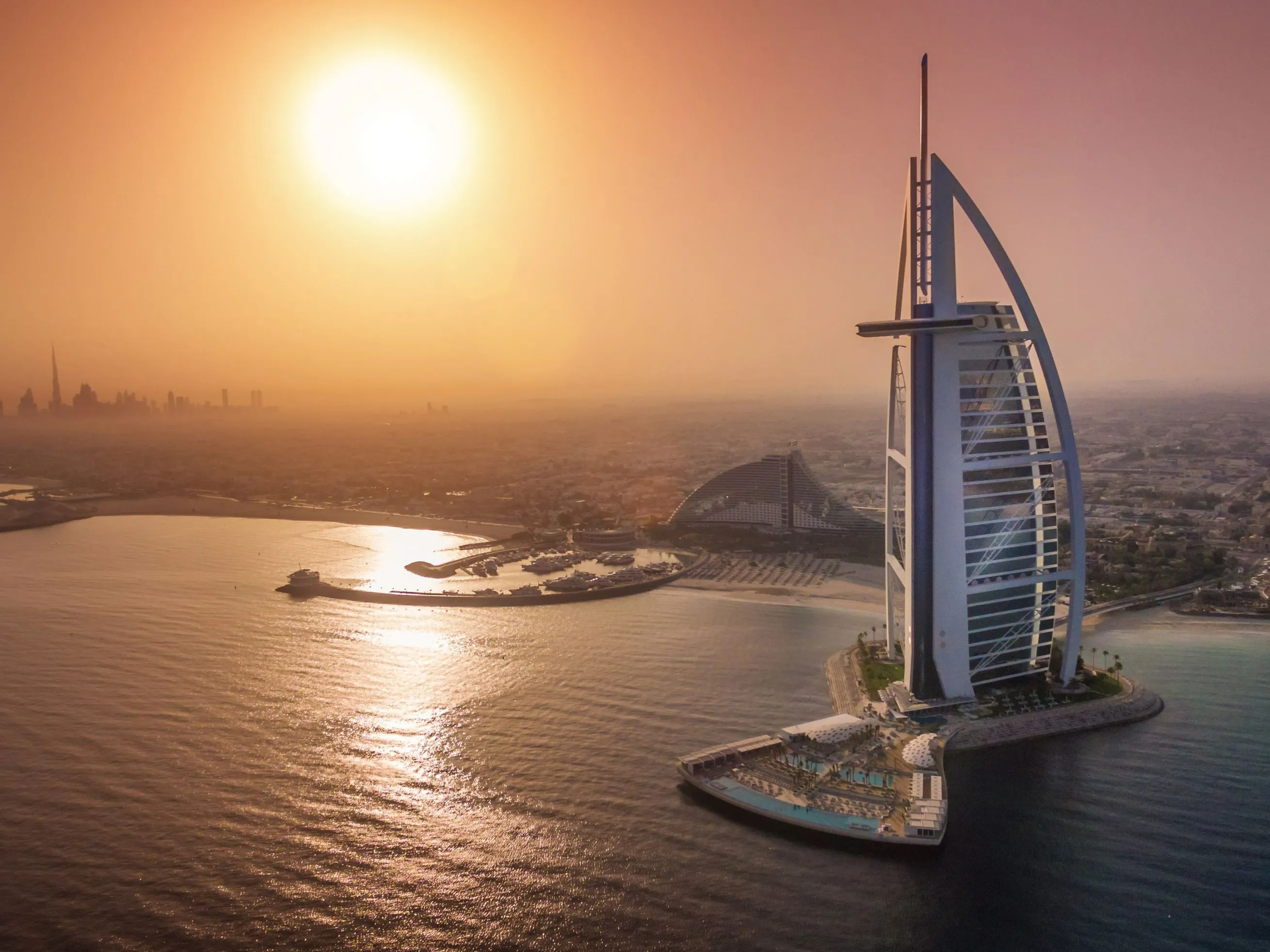 Aerial sunset view of Burj Al Arab from sea