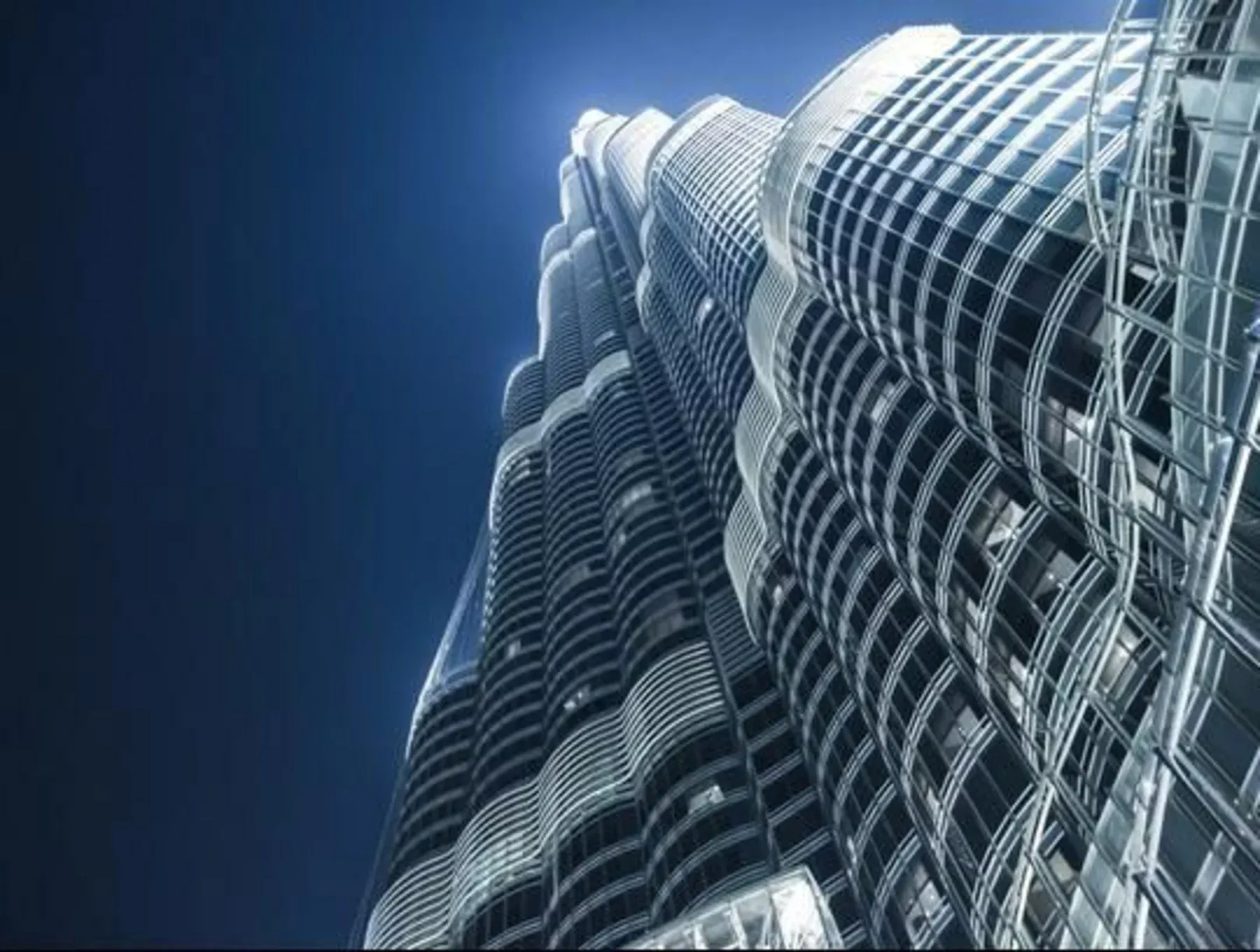 Wide-angle shot from the pools at the base of Burj Khalifa