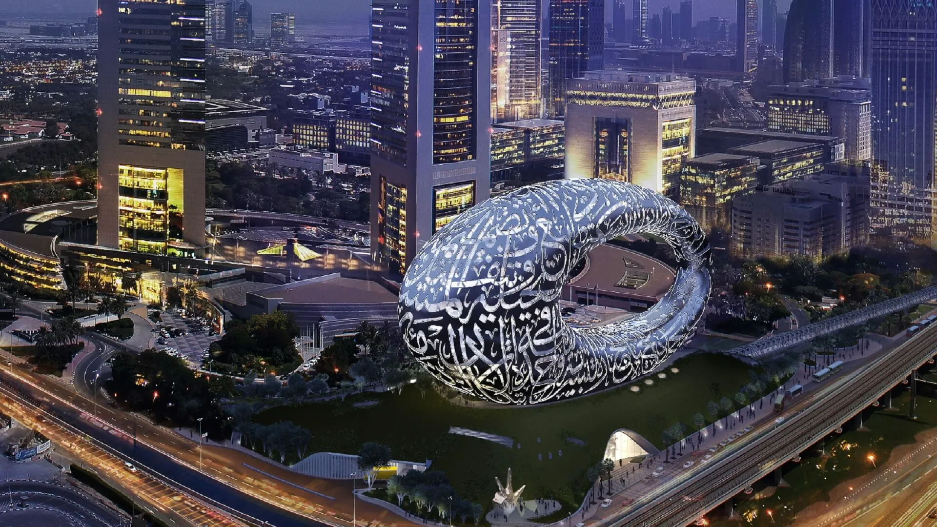 Aerial night view of the Museum of the Future and Dubai skyline
