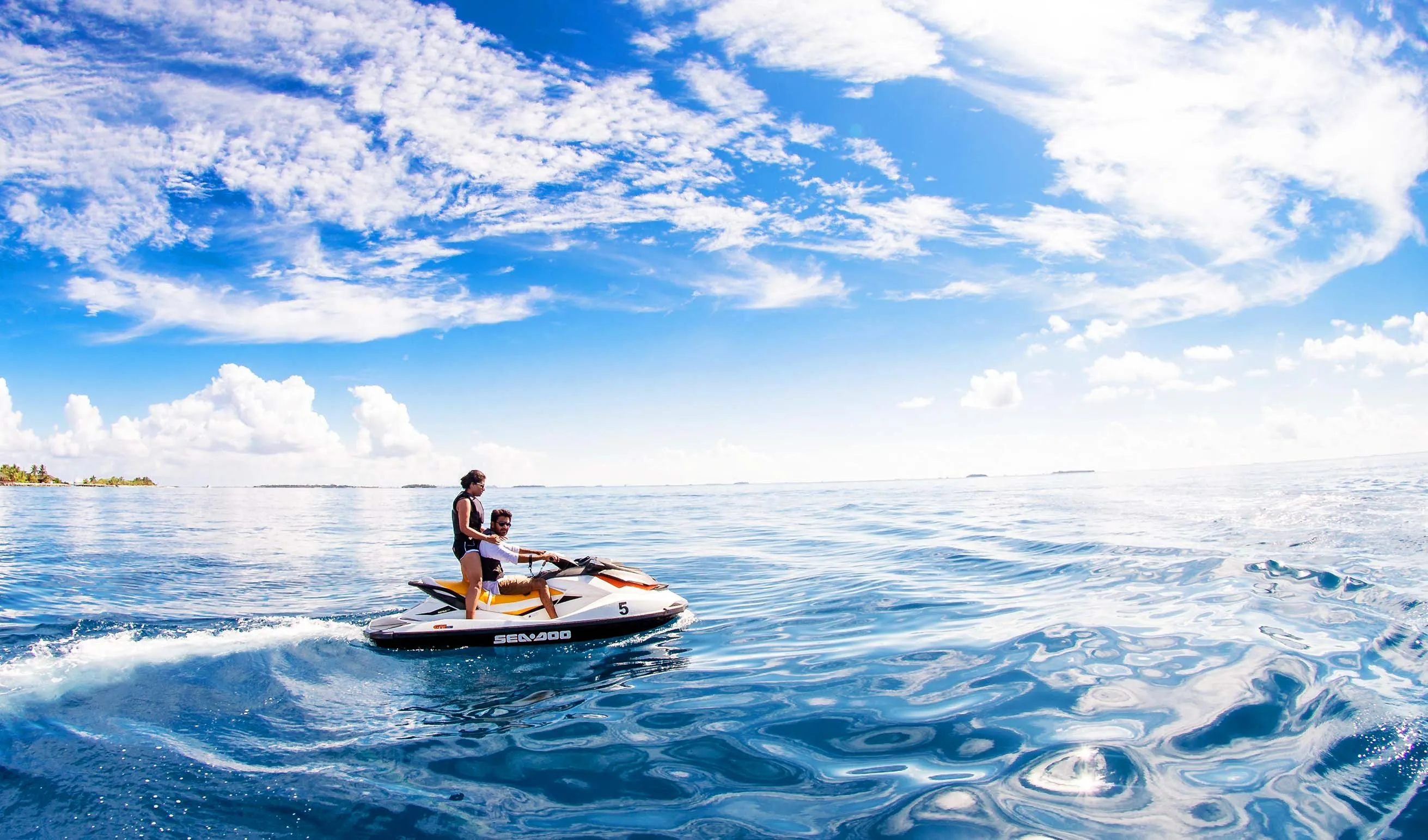 Couple enjoying a jet ski ride in Dubai