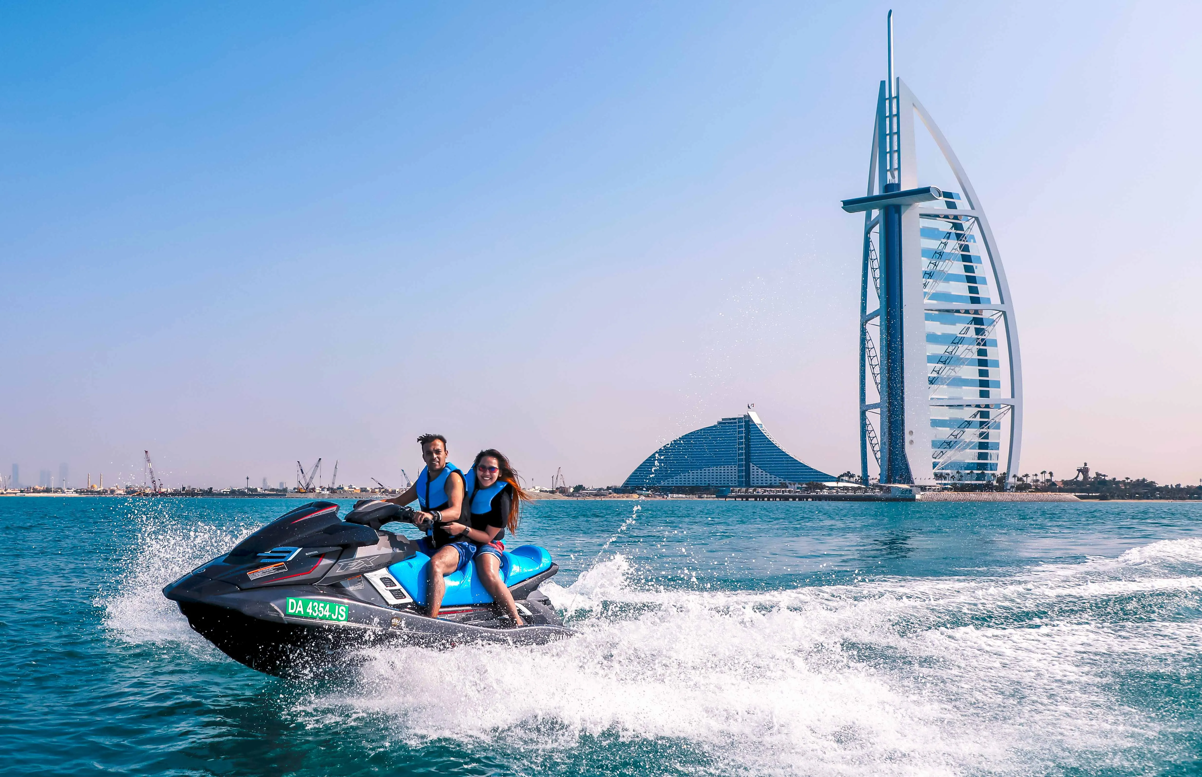 Couple on jet ski near Burj Al Arab
