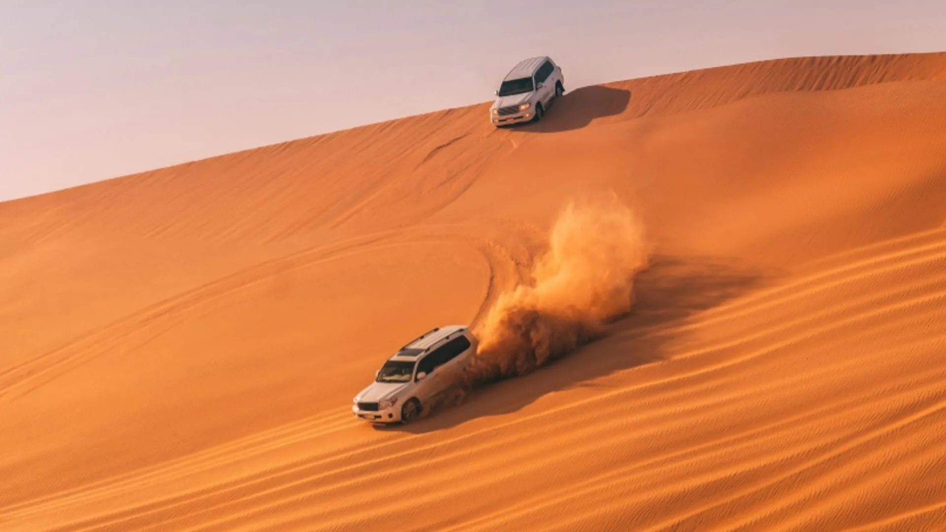 Desert safari with jeeps and sand dunes