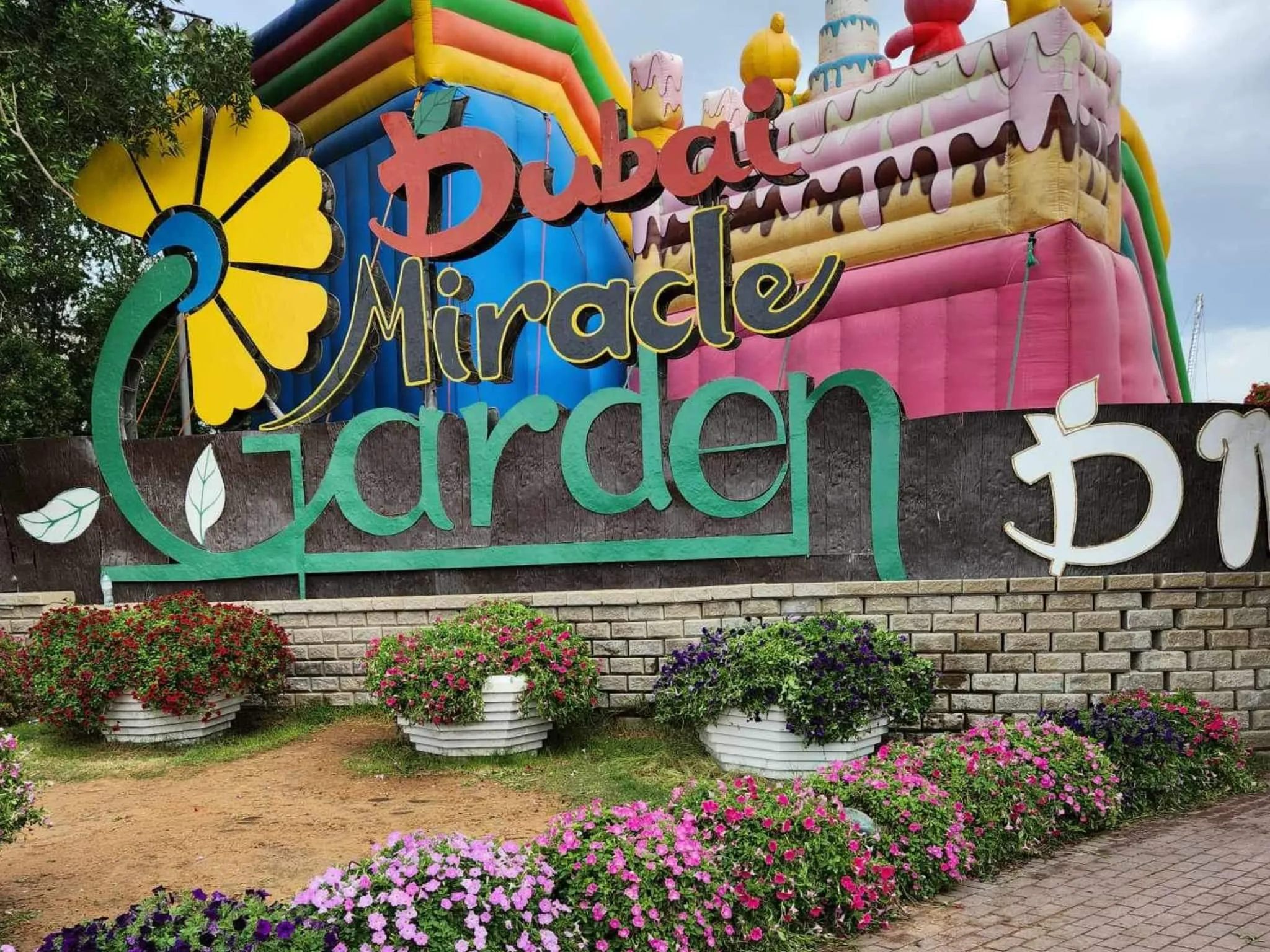 Dubai Miracle Garden entrance logo