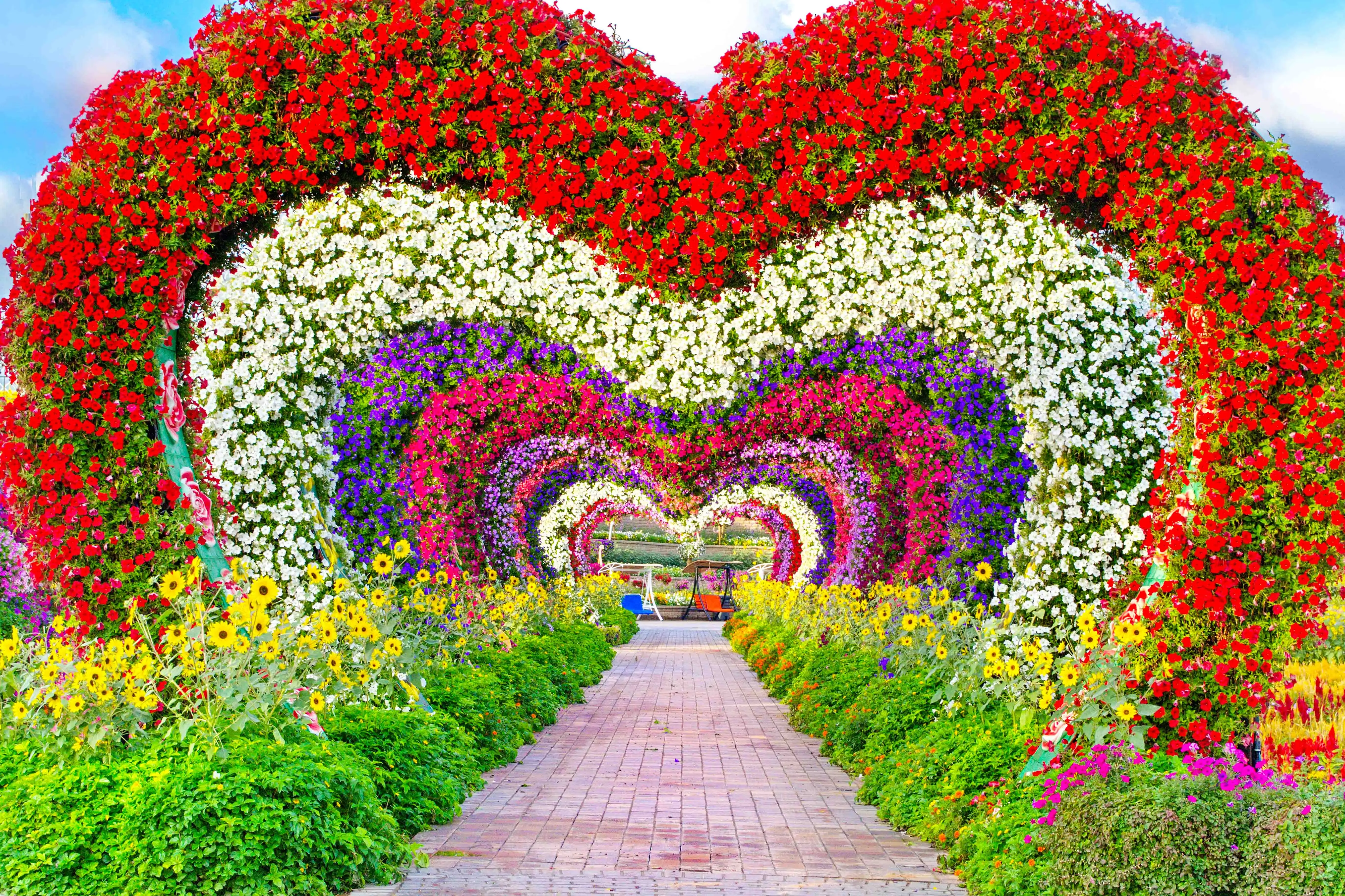 Heart-shaped floral arch at entrance