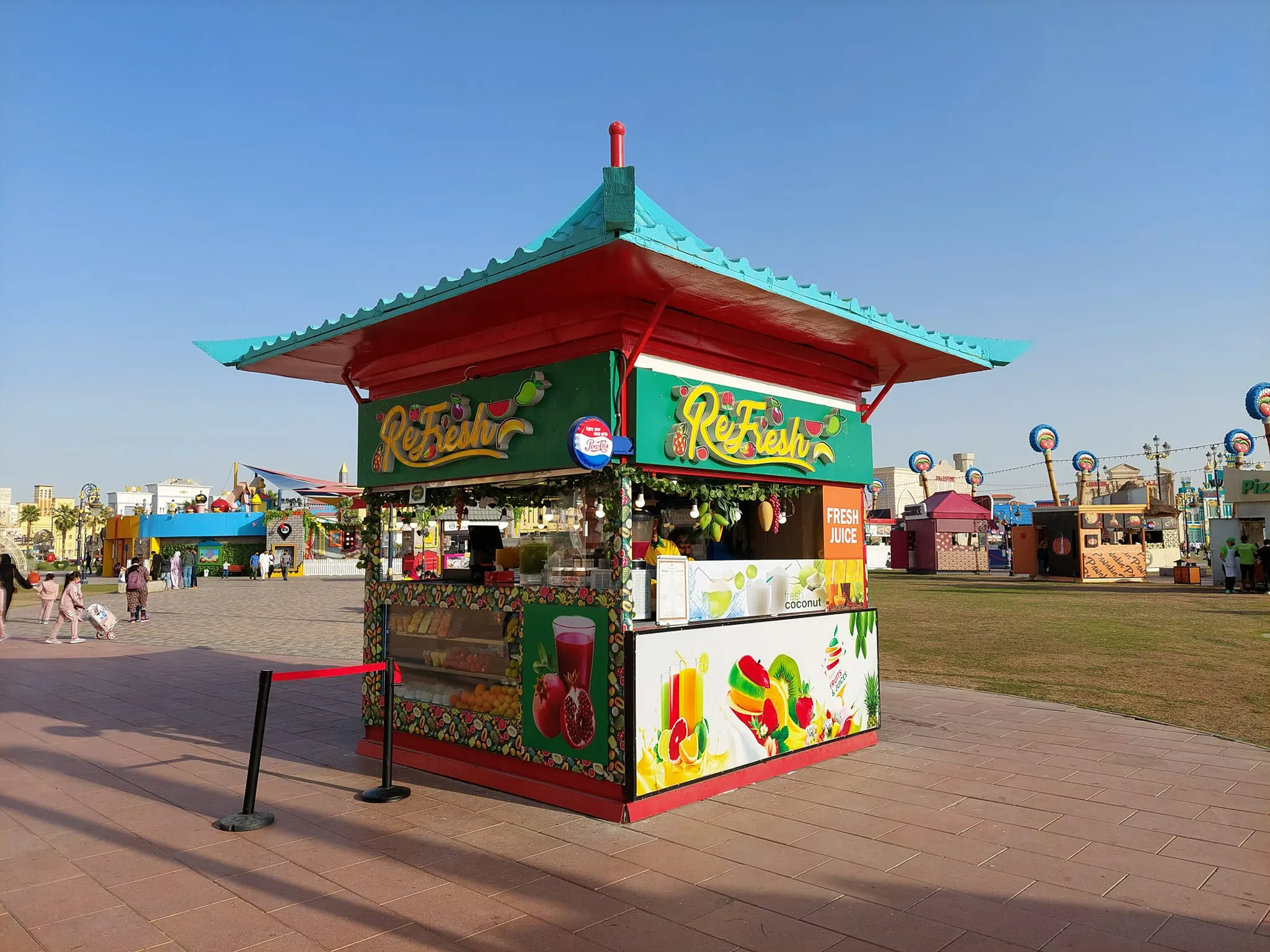 Ice cream kiosk serving colorful scoops at Global Village