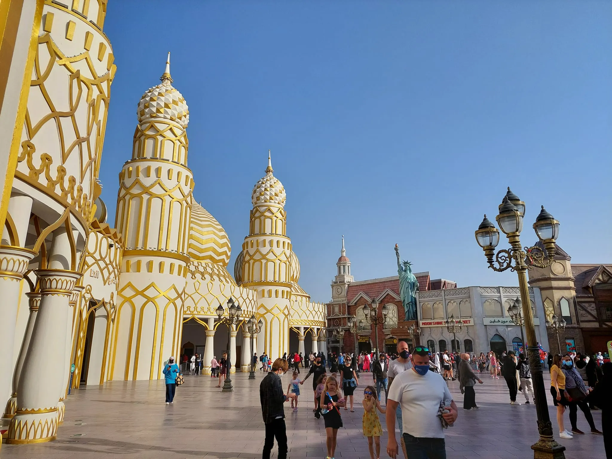 Crowds watching a performance in Global Village square