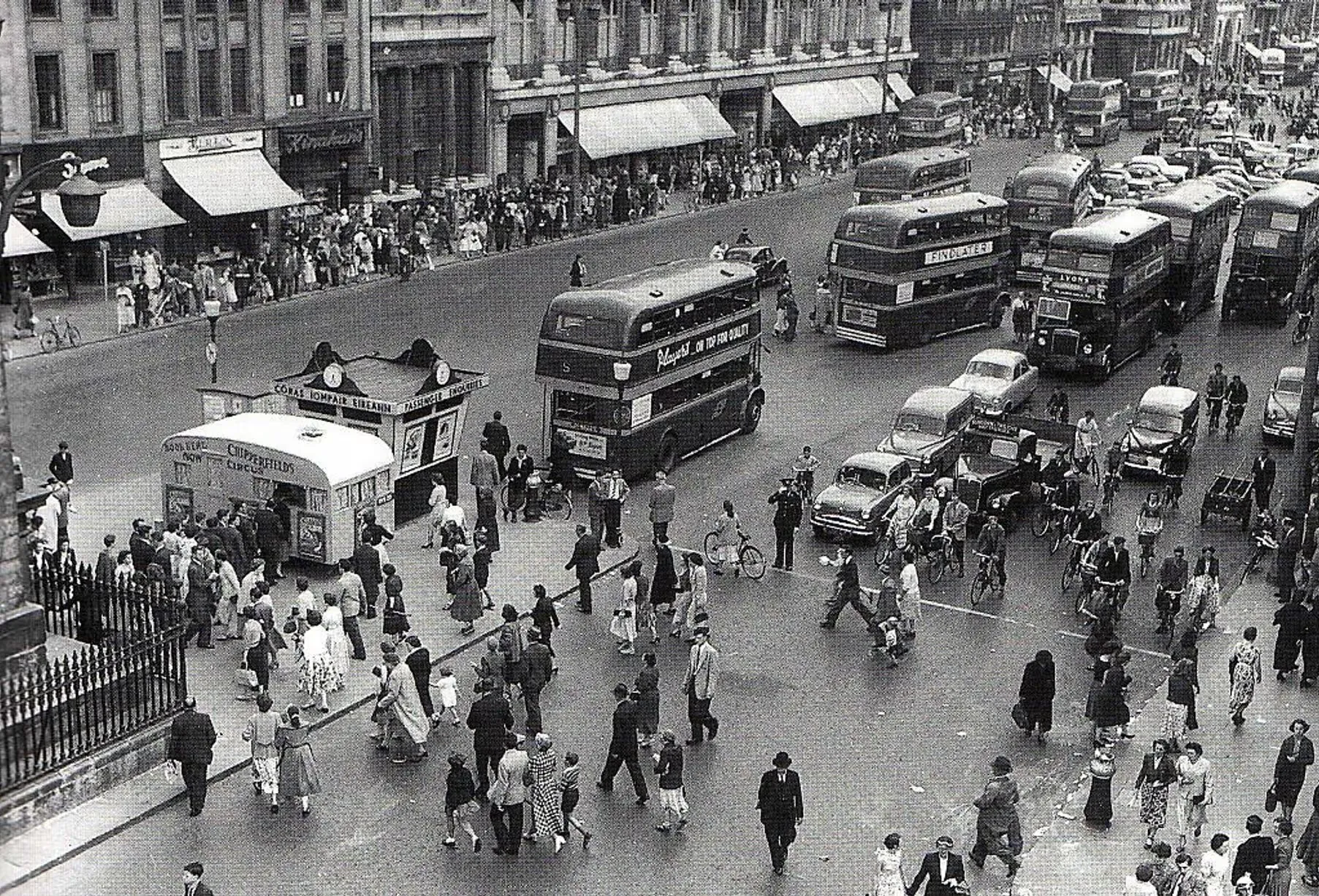 1960s crowded street with double deckers