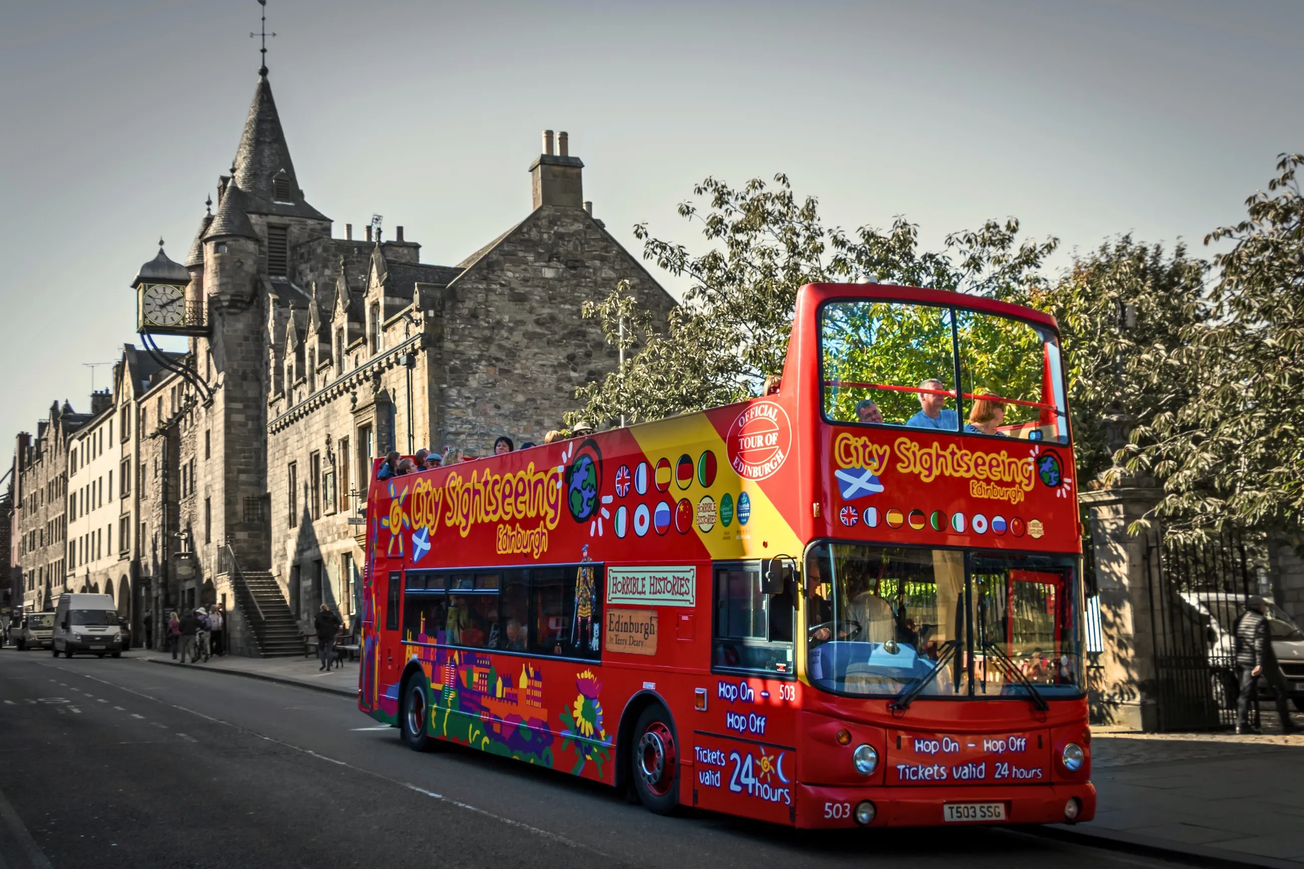 Sightseeing bus passing Royal Mile
