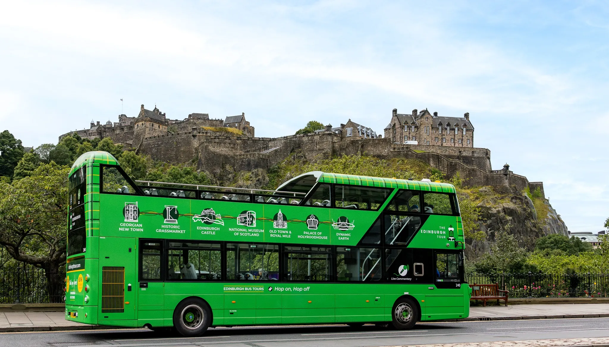 Tour bus with castle background