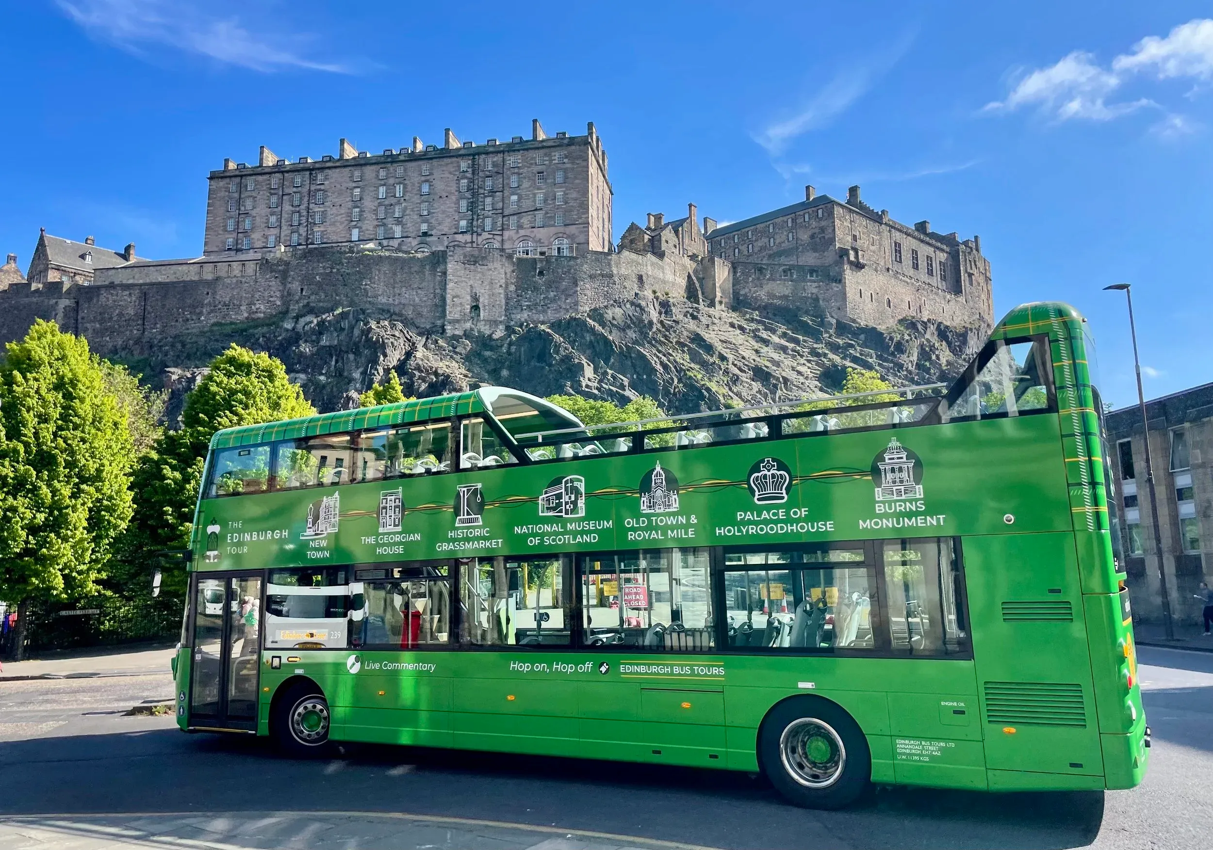 Tour bus with castle backdrop