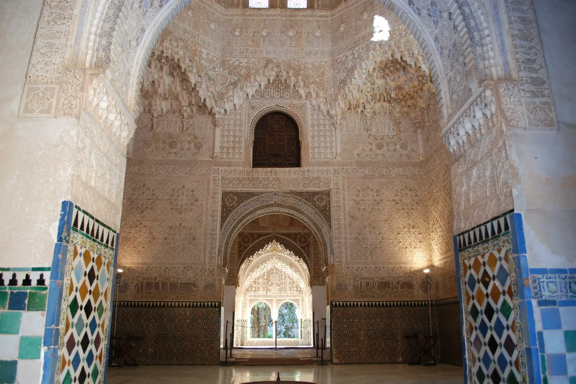 Geometric tile mosaics and carved doorway at the Alhambra