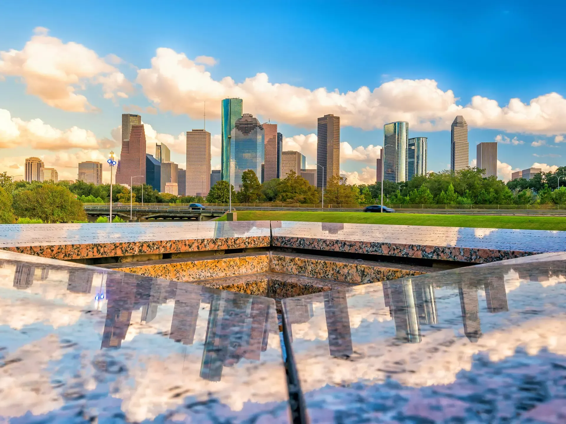 Modern downtown Houston buildings along a broad avenue