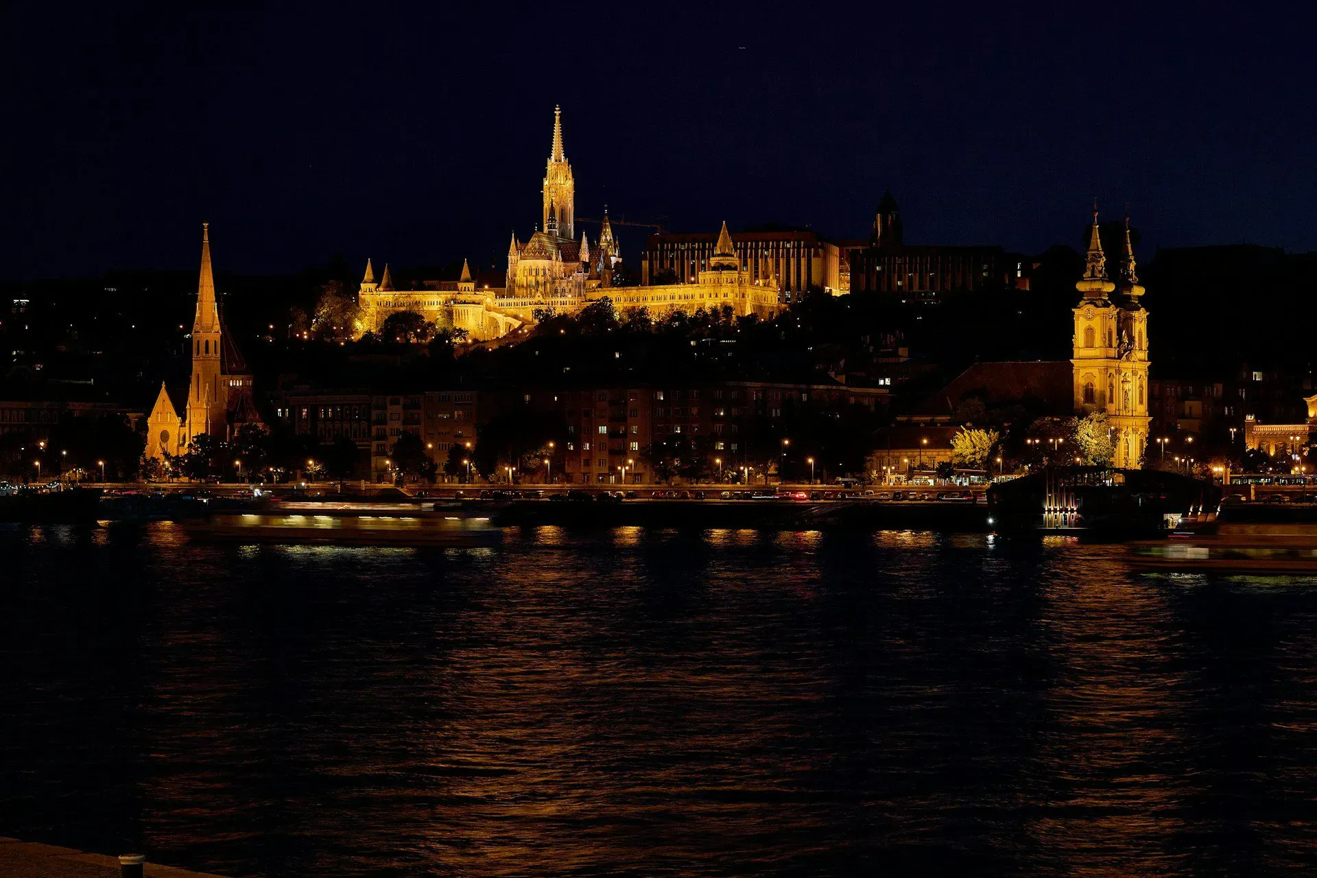 Historic riverside architecture above the Danube at night