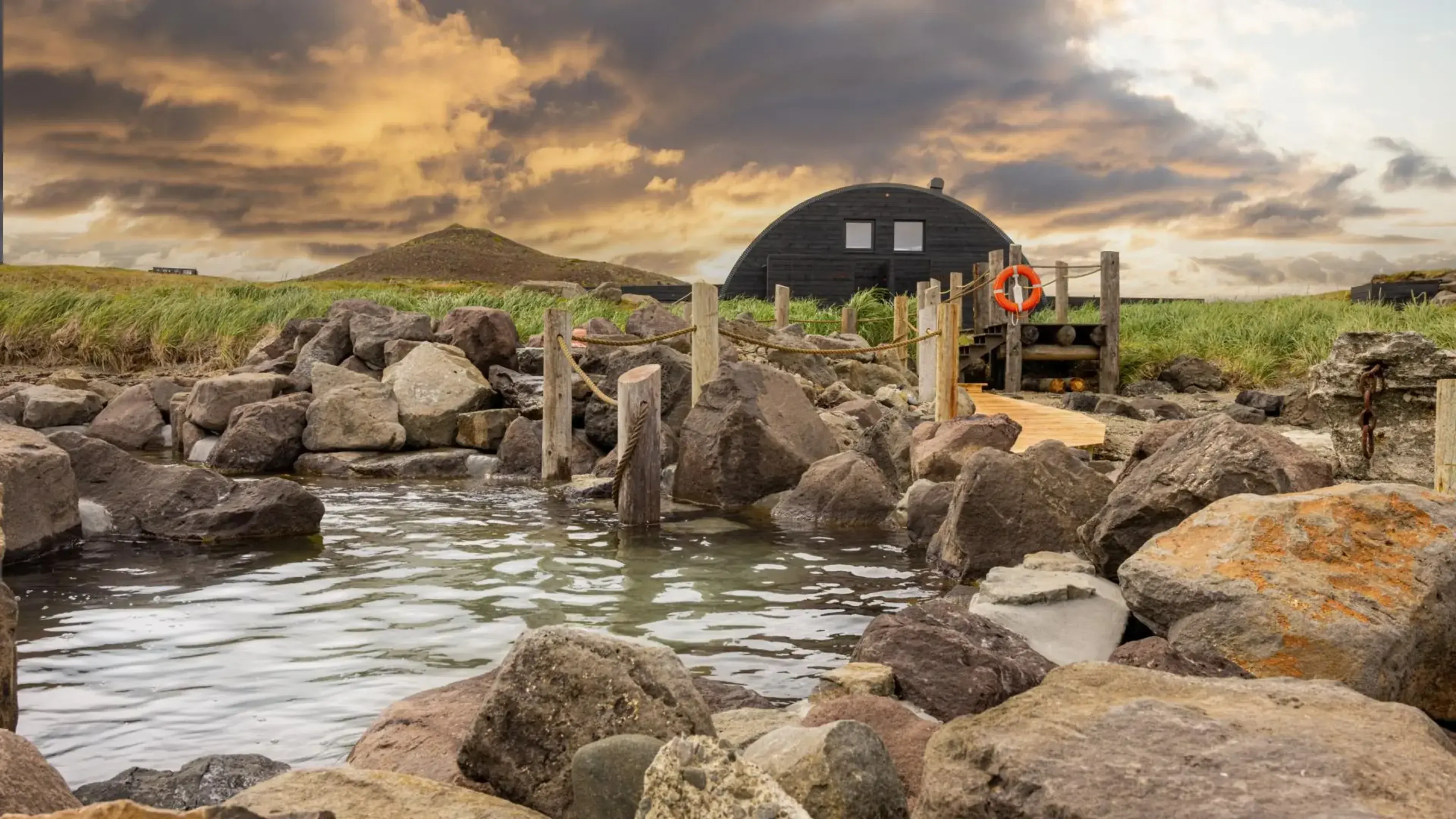 Hvammsvik hot springs from the shoreline
