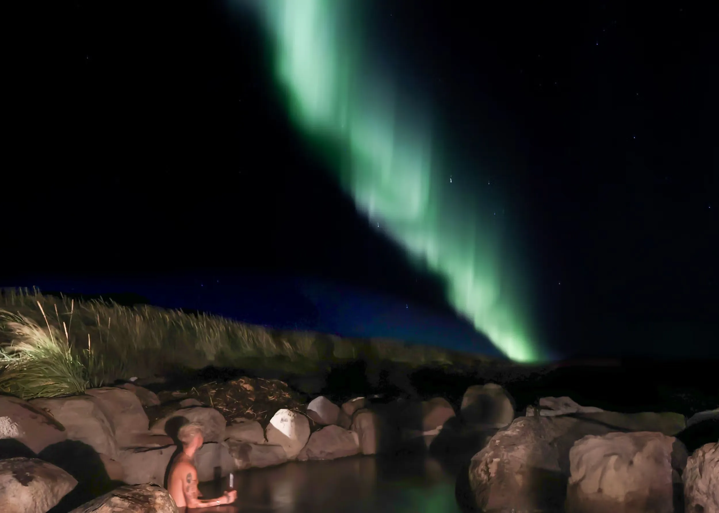 Hvammsvik baths under the northern lights