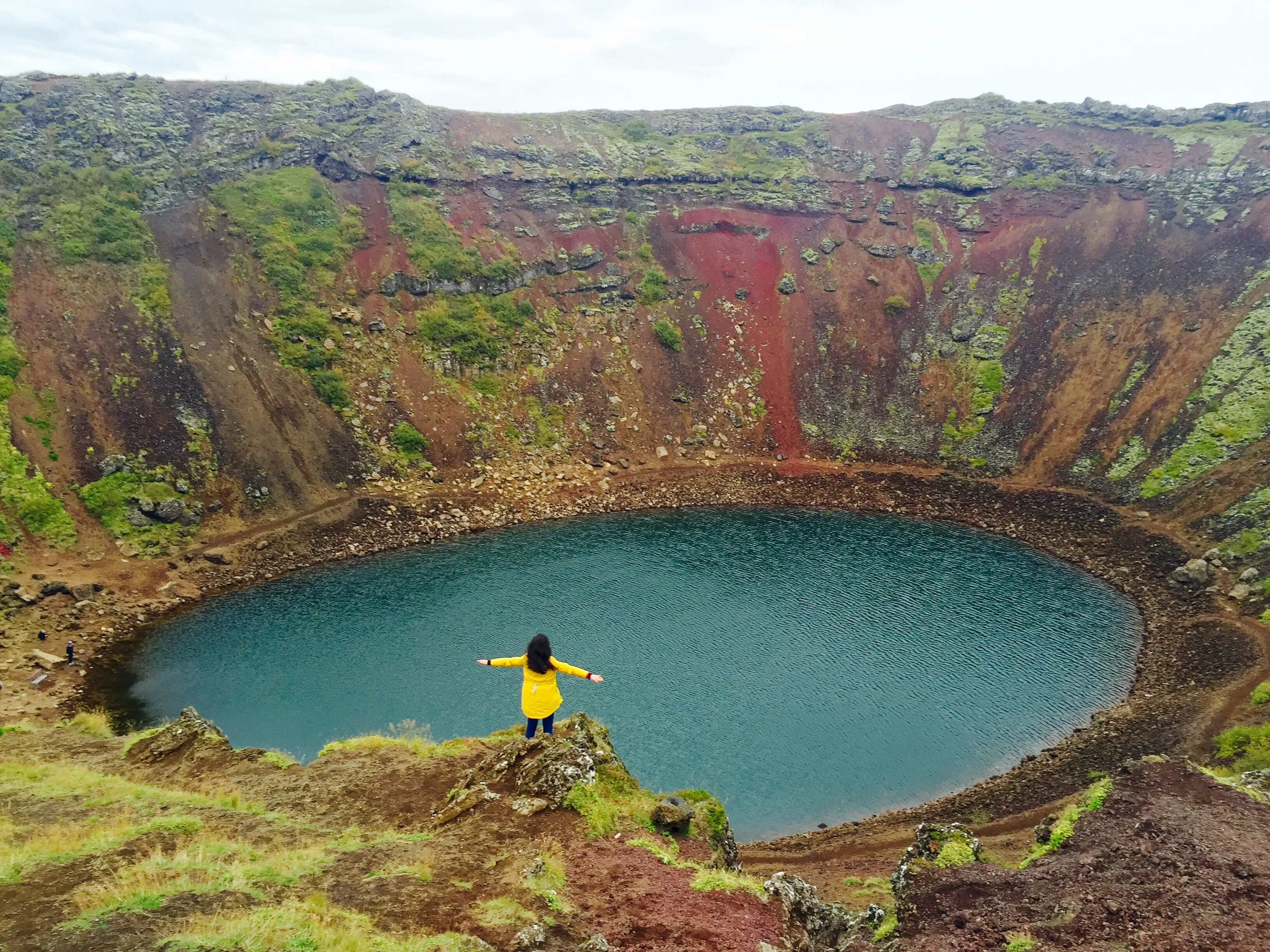 Visitor standing at the top of Kerid Crater