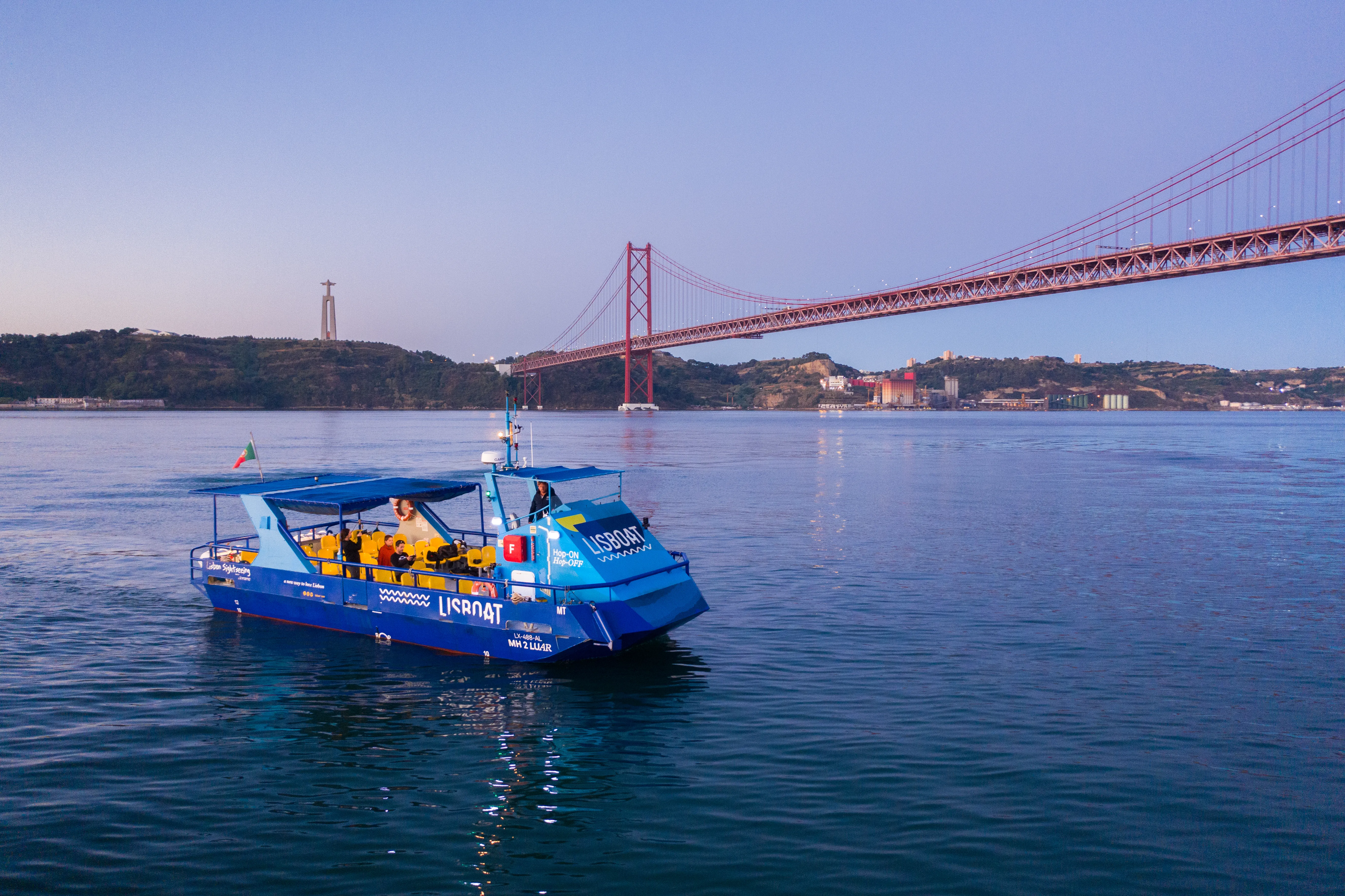 Yellow Boat cruising on the Tagus near Belém