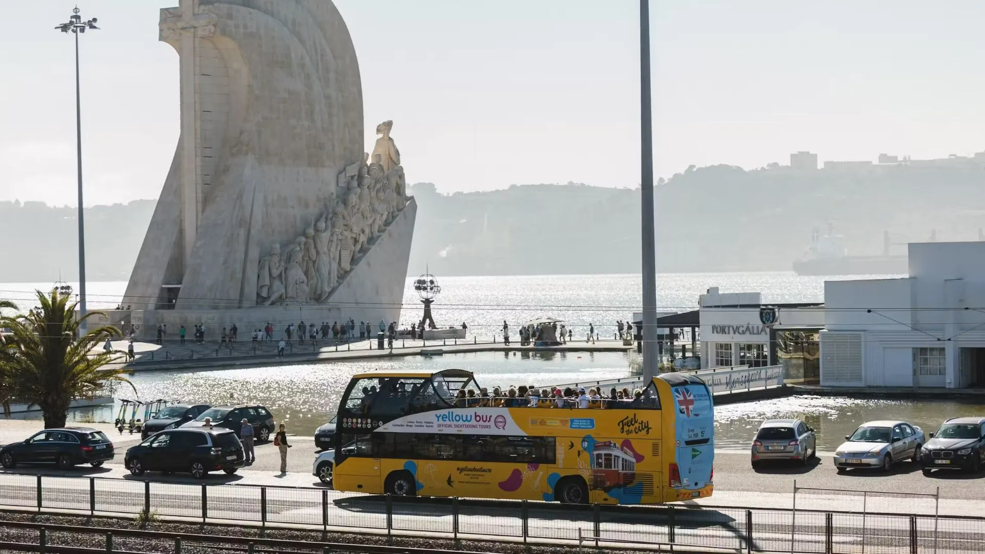 Sightseeing bus by the Tagus river