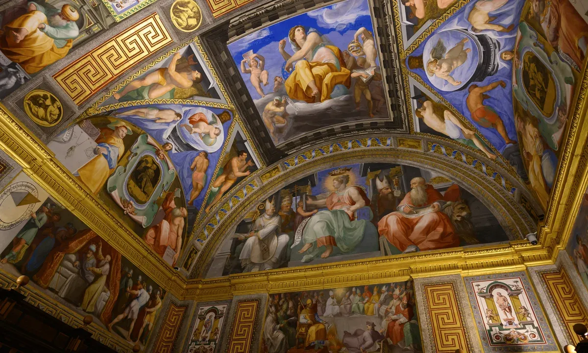 El Escorial library with gilded ceiling and long shelves
