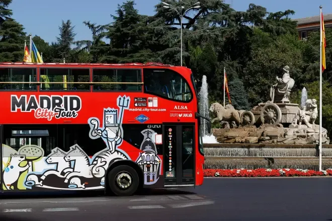 City tour buses at a central Madrid stop