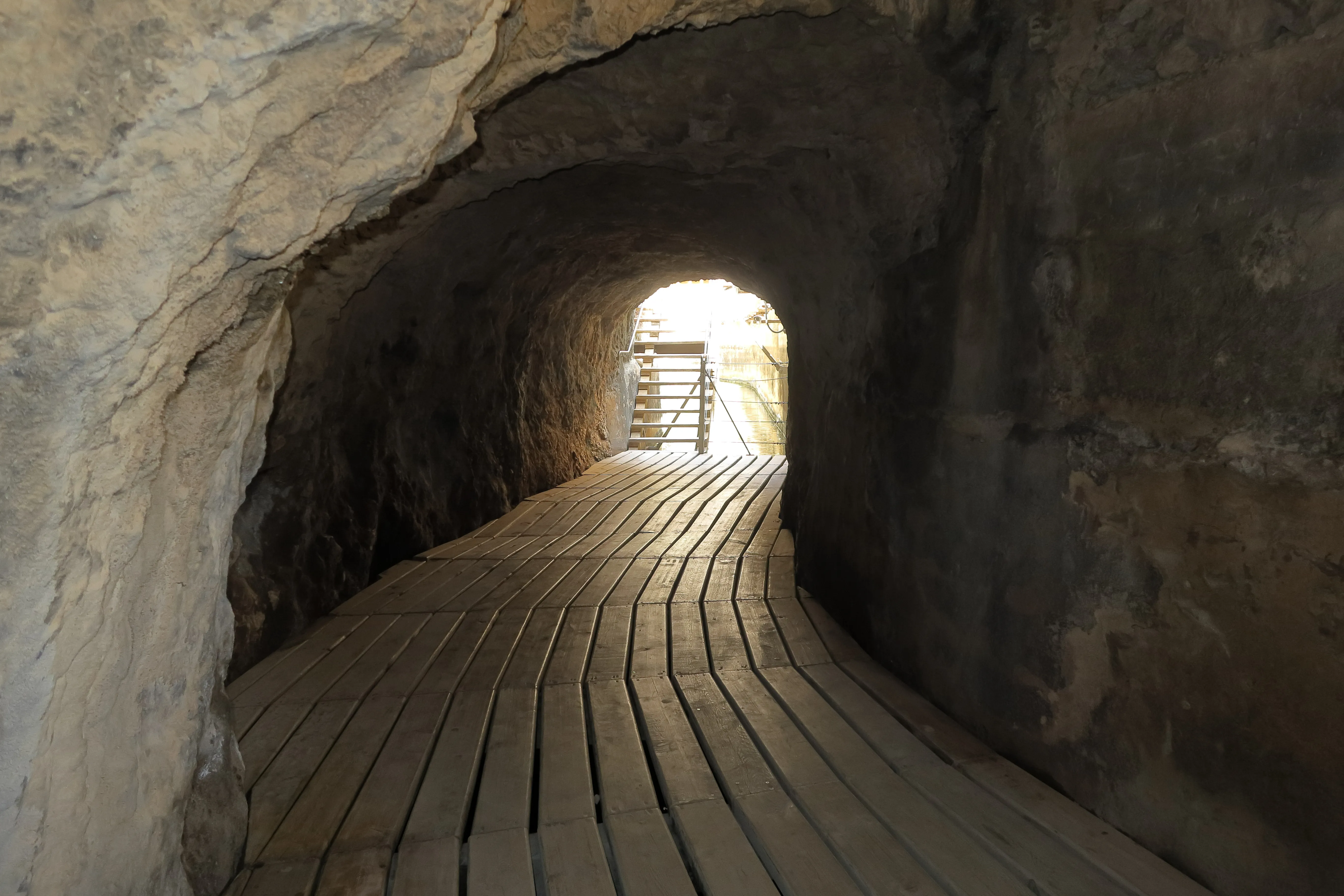 Service tunnel carved into the canyon wall