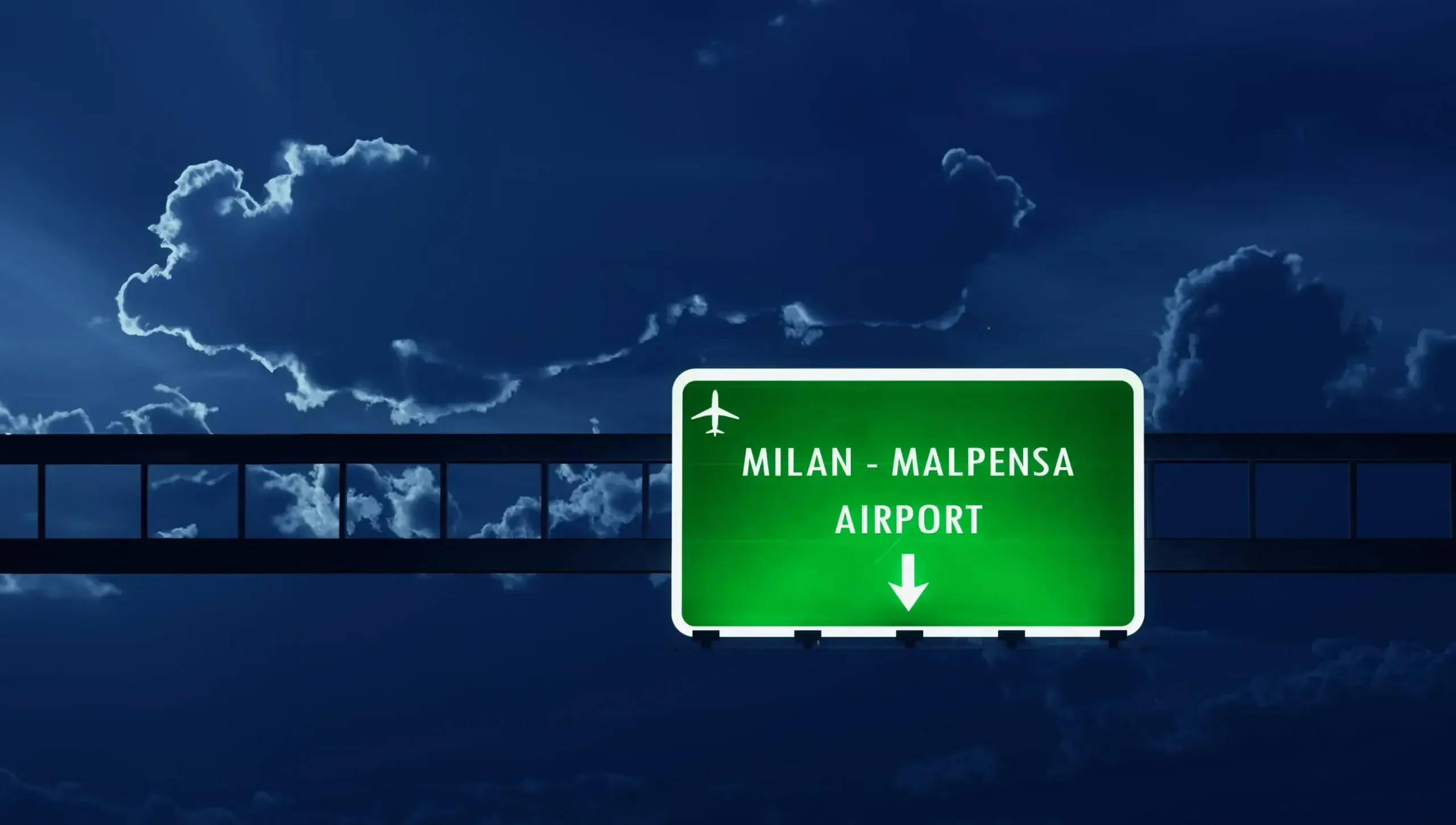 Road signs indicating routes toward Milan city center