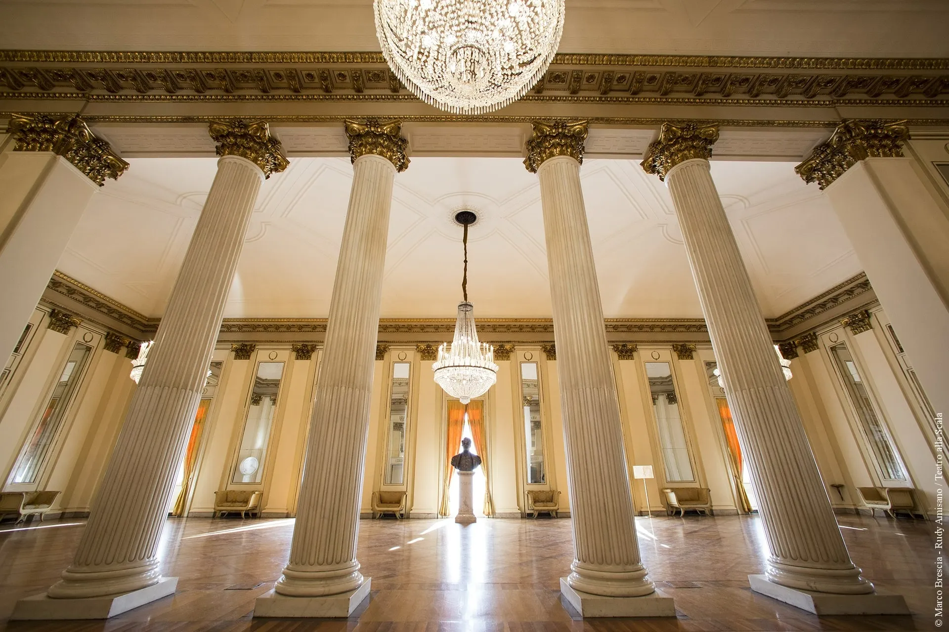 Main auditorium with chandelier and red velvet seating