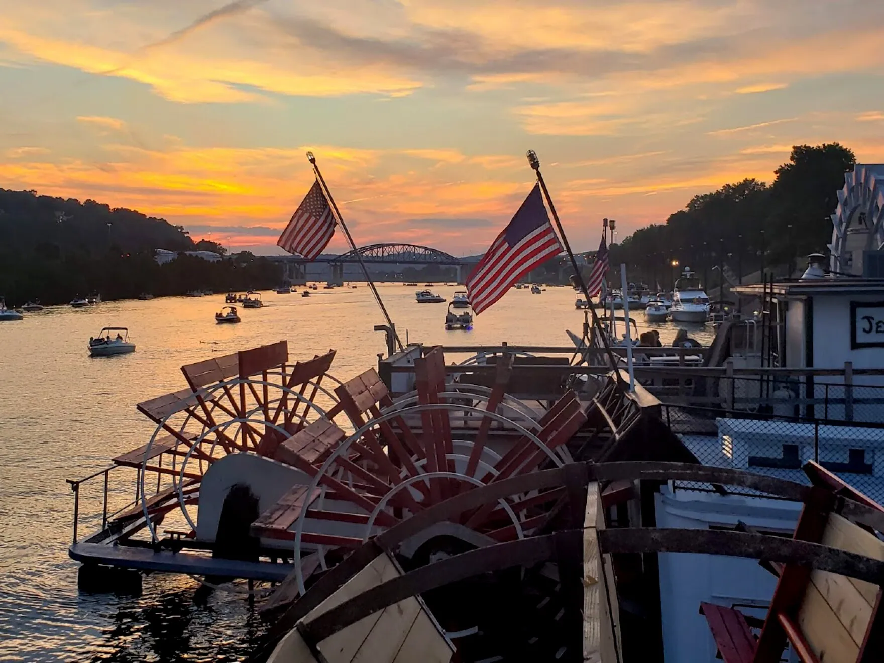 Sunset over a paddlewheel boat docked on the Mississippi