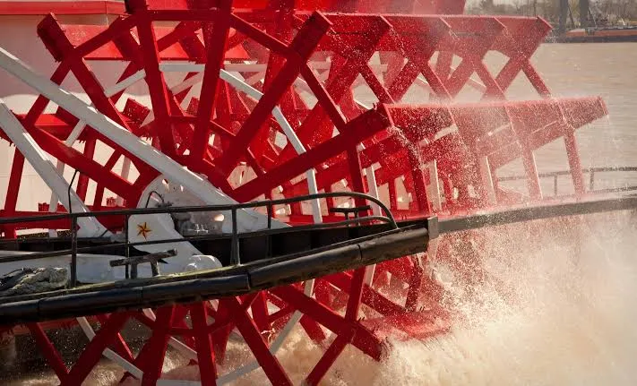 Close-up of a paddle wheel turning on a riverboat
