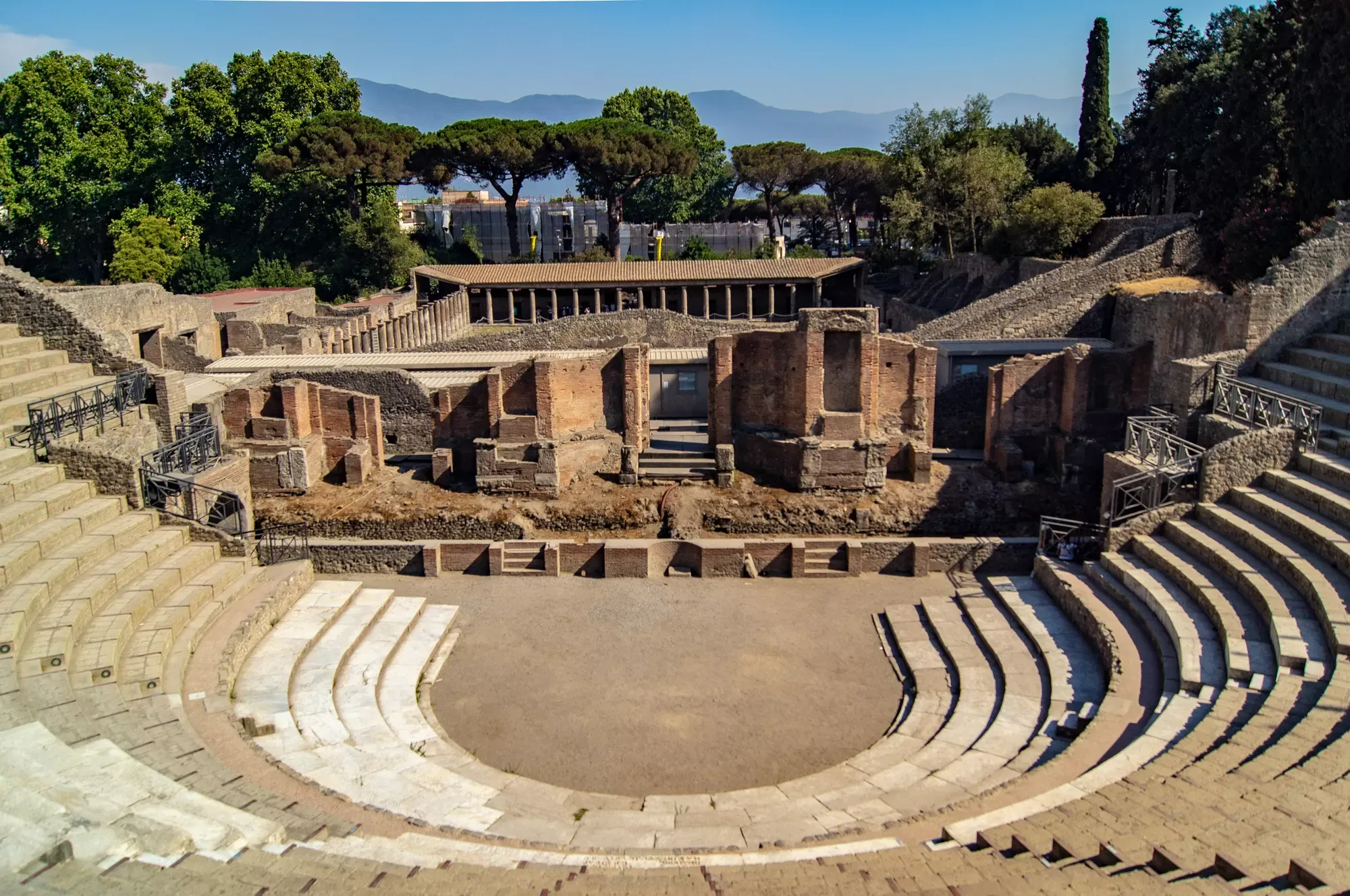 Roman amphitheatre of Pompeii with stone seating and central arena
