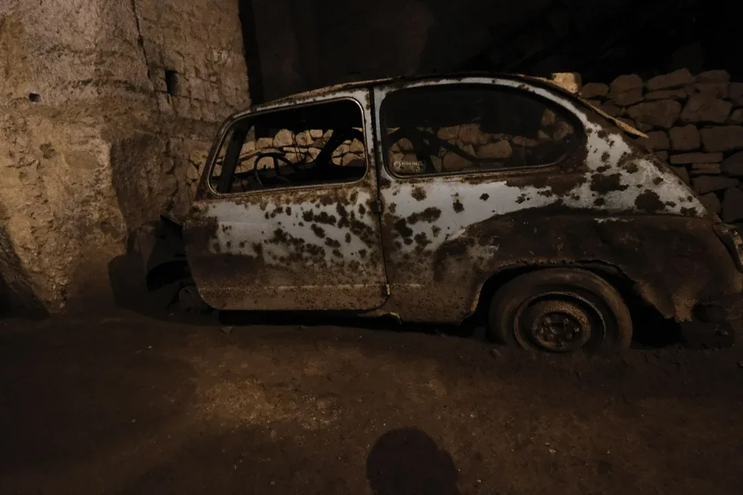 Rusty buried car found in the tunnels of Galleria Borbonica