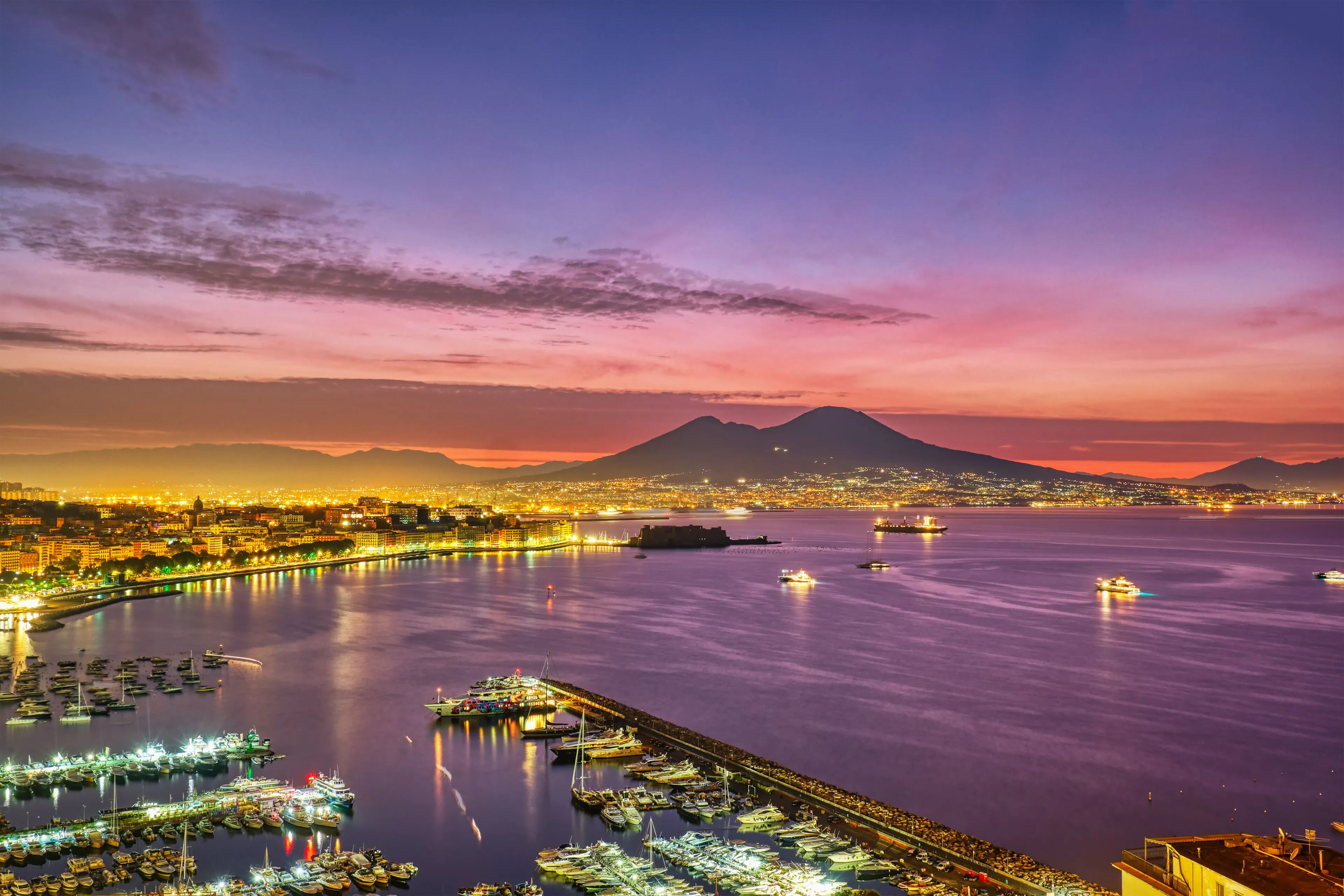 Mount Vesuvius at sunrise with warm light over the crater