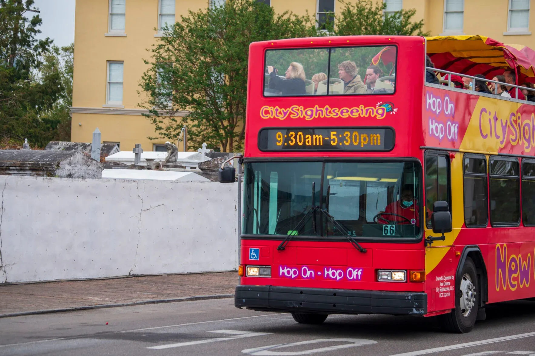 Sightseeing Bus Passing by St. Louis Cathedral