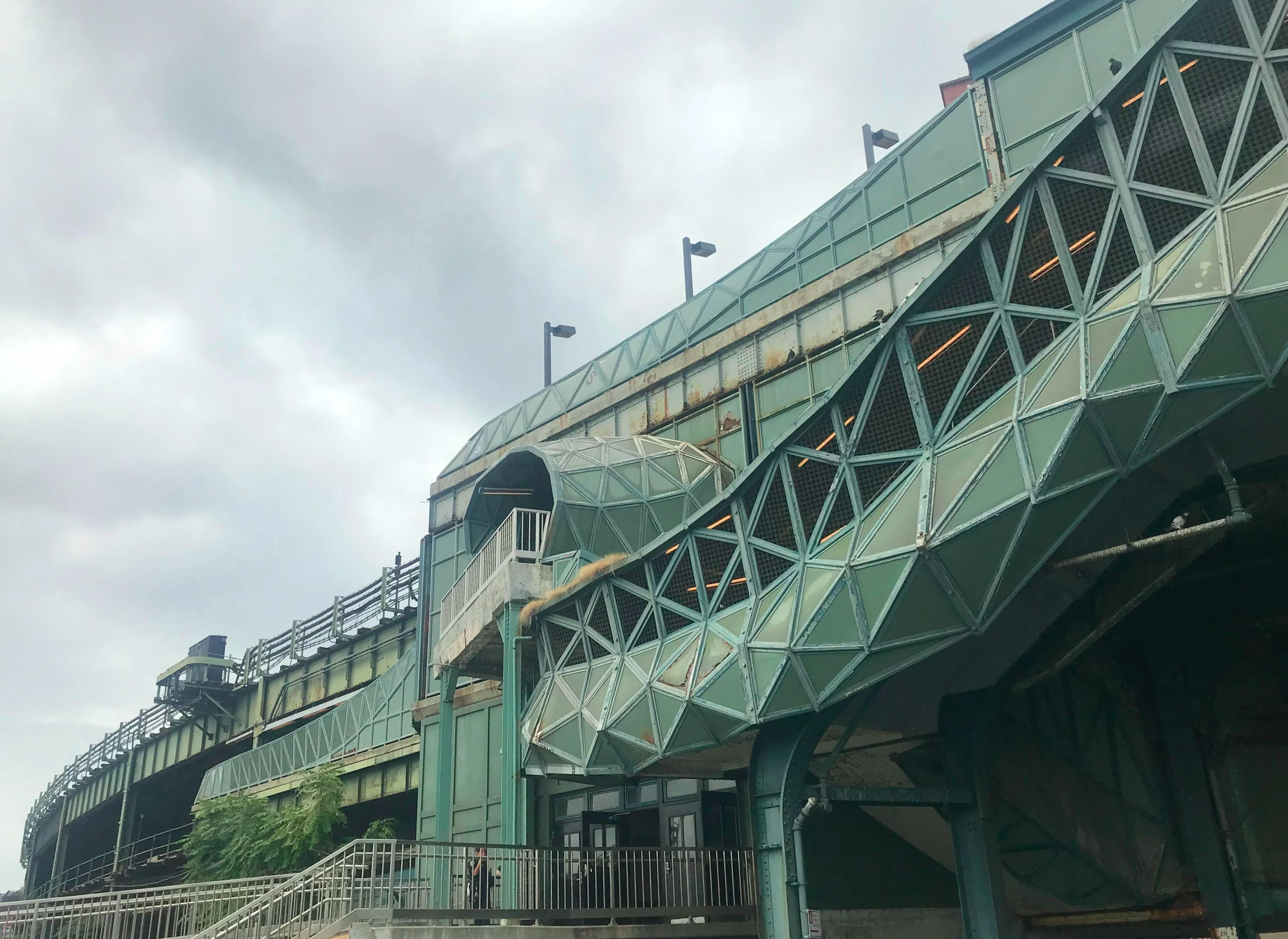 Entrance and exterior view of the New York Aquarium with signage and visitors