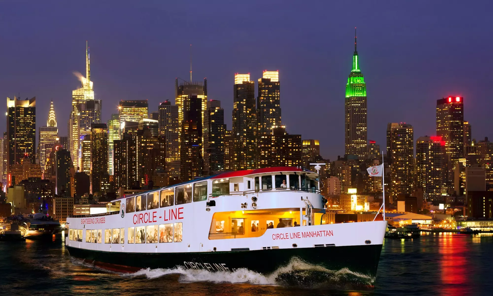 Night cruise with illuminated New York skyline