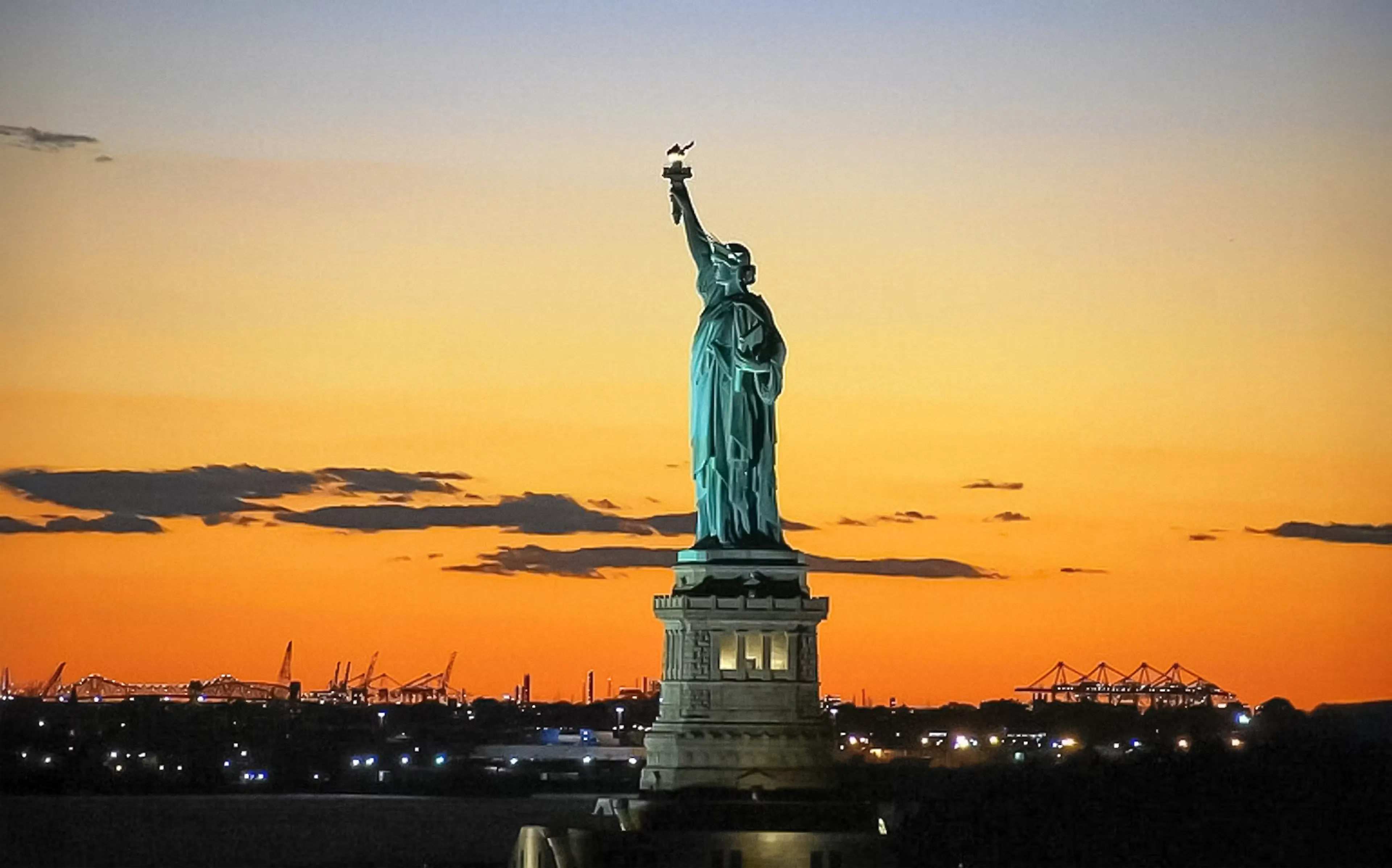 Statue of Liberty at sunset during a harbor cruise